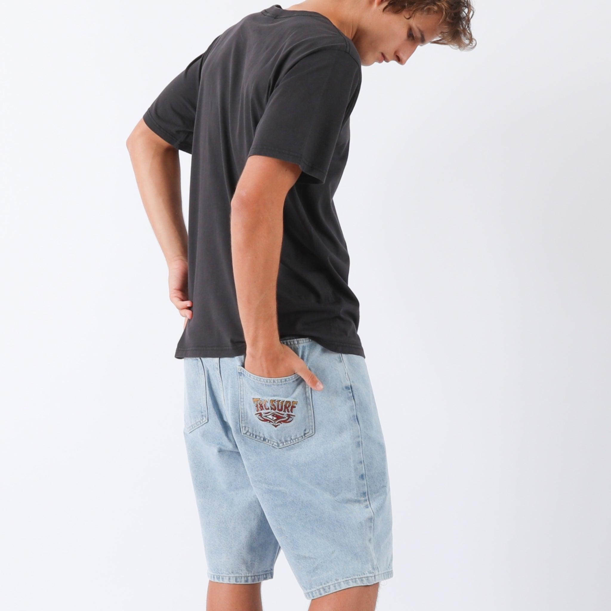 Model wearing denim shorts