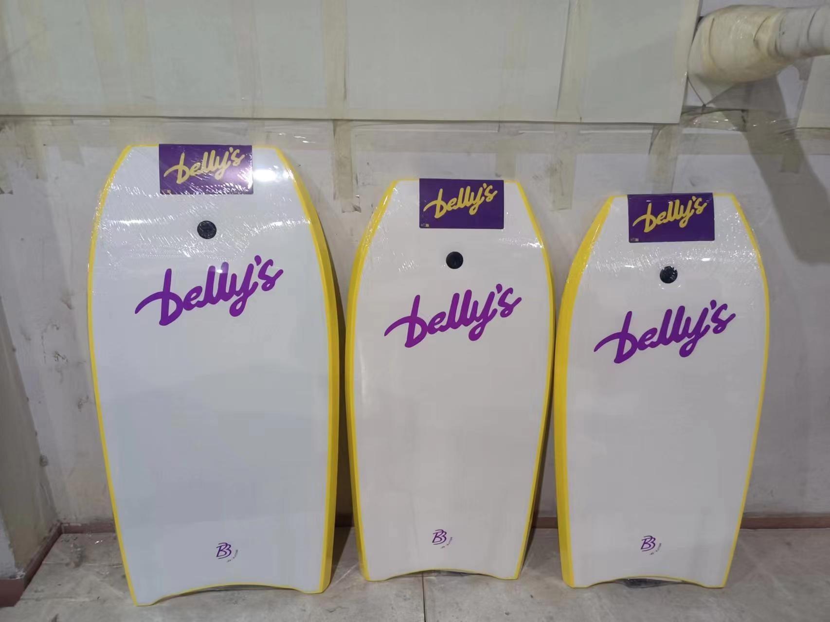 Three yellow bodyboards back