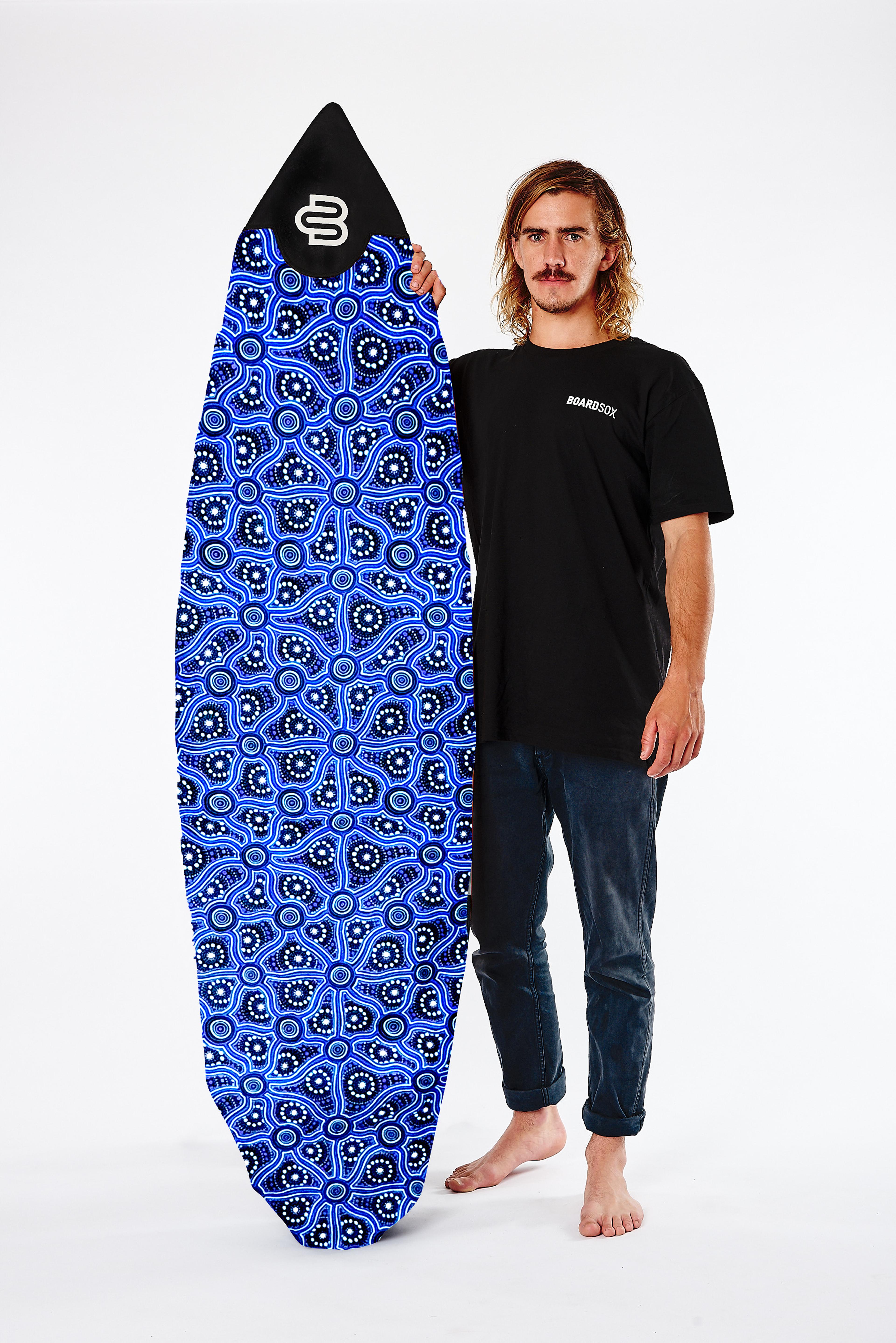 Model holding surfboard