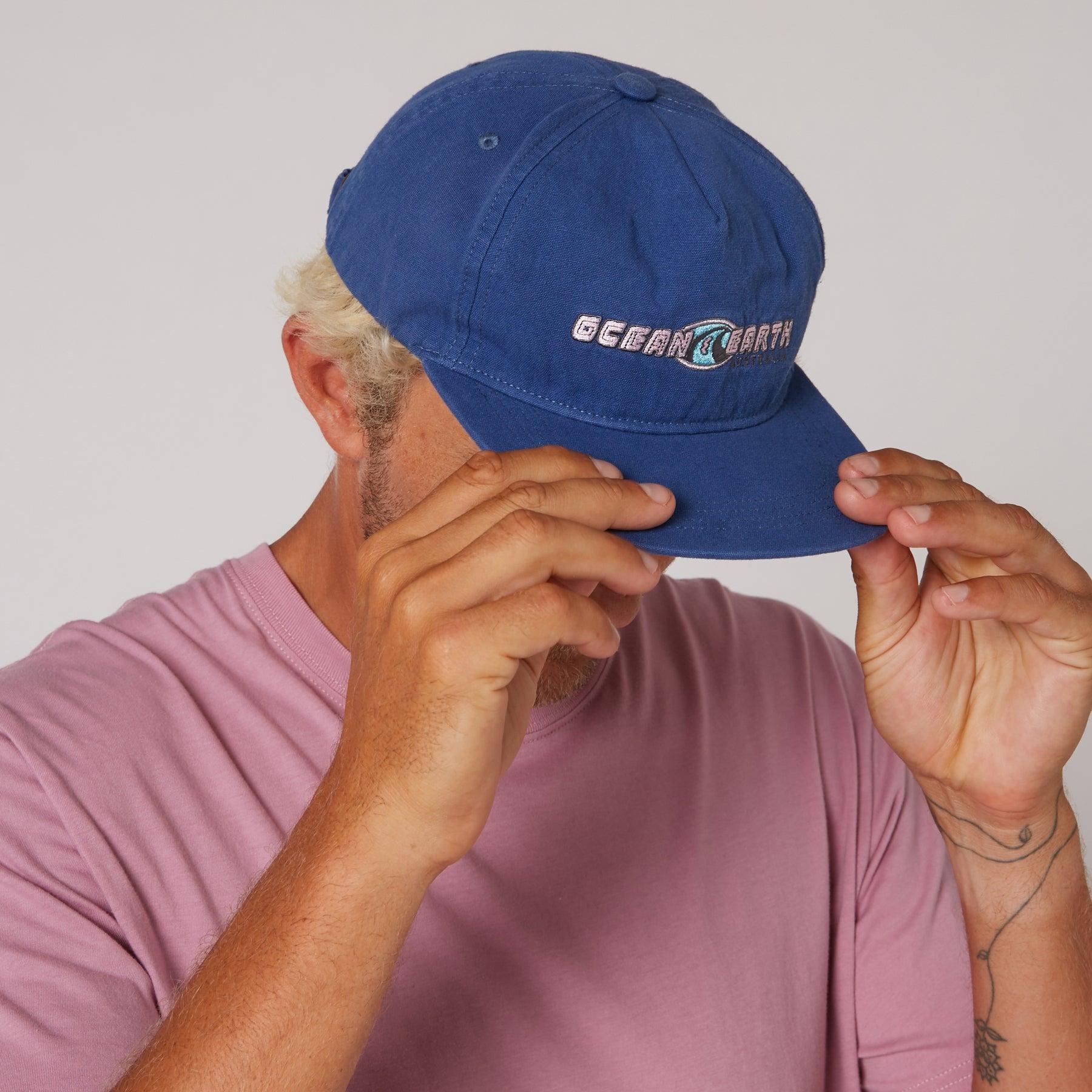 Person wearing Denim Blue cap
