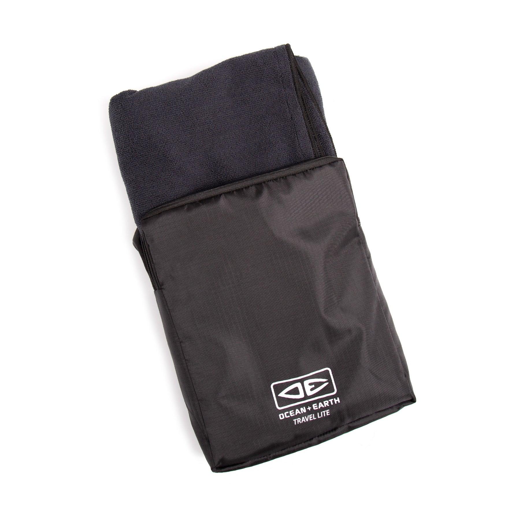 Towel folded in black mesh bag