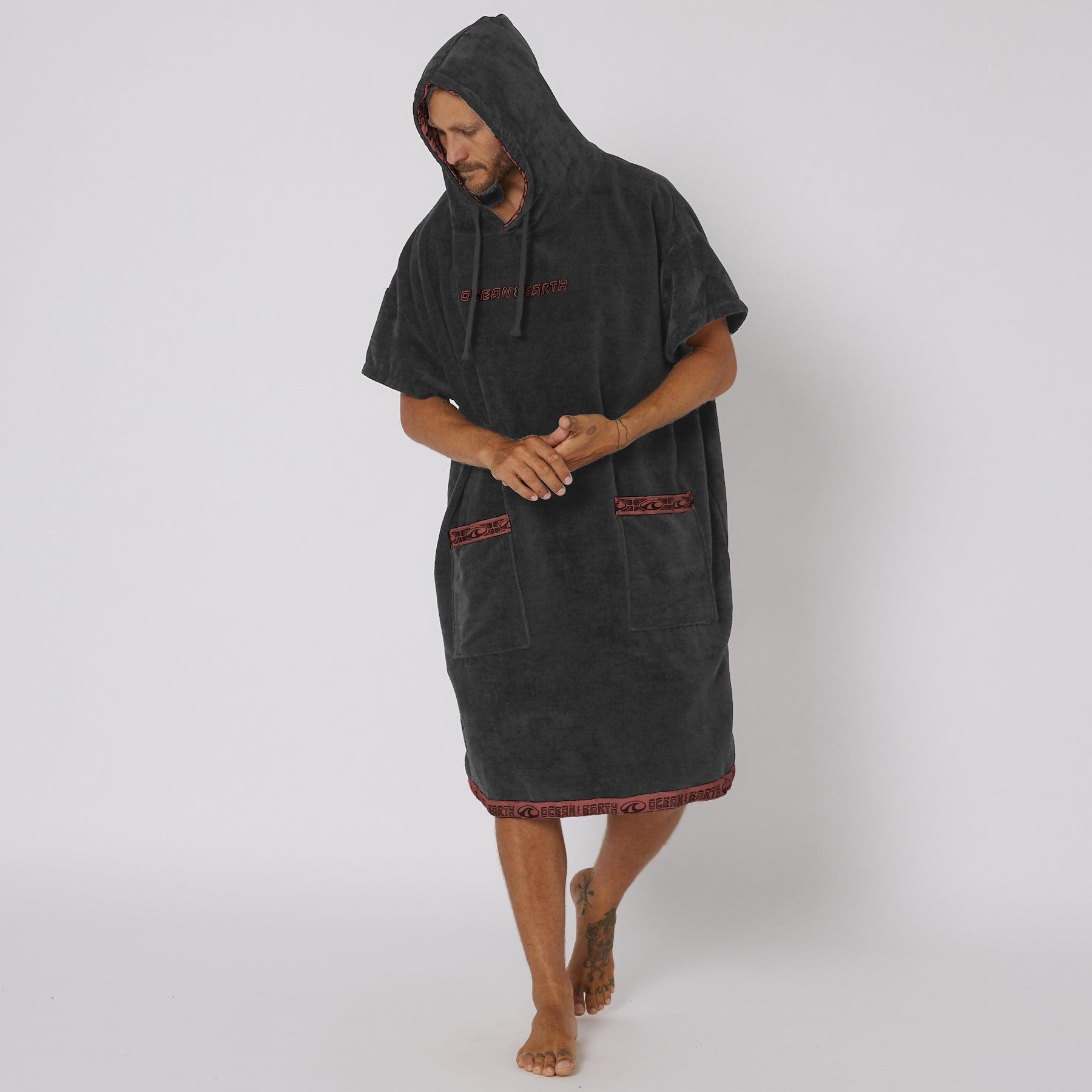Model wearing dull black poncho