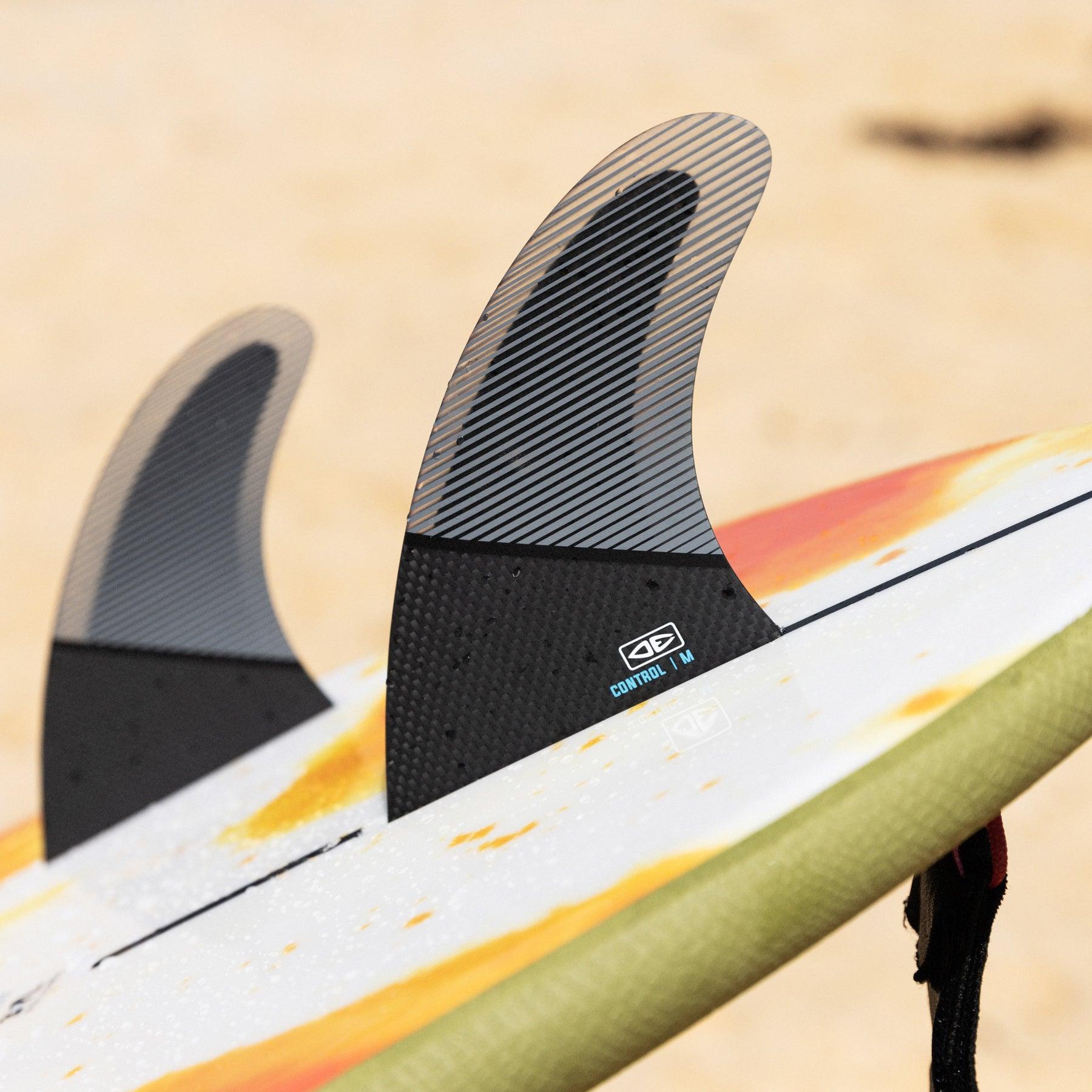 Surfboard fins on beach