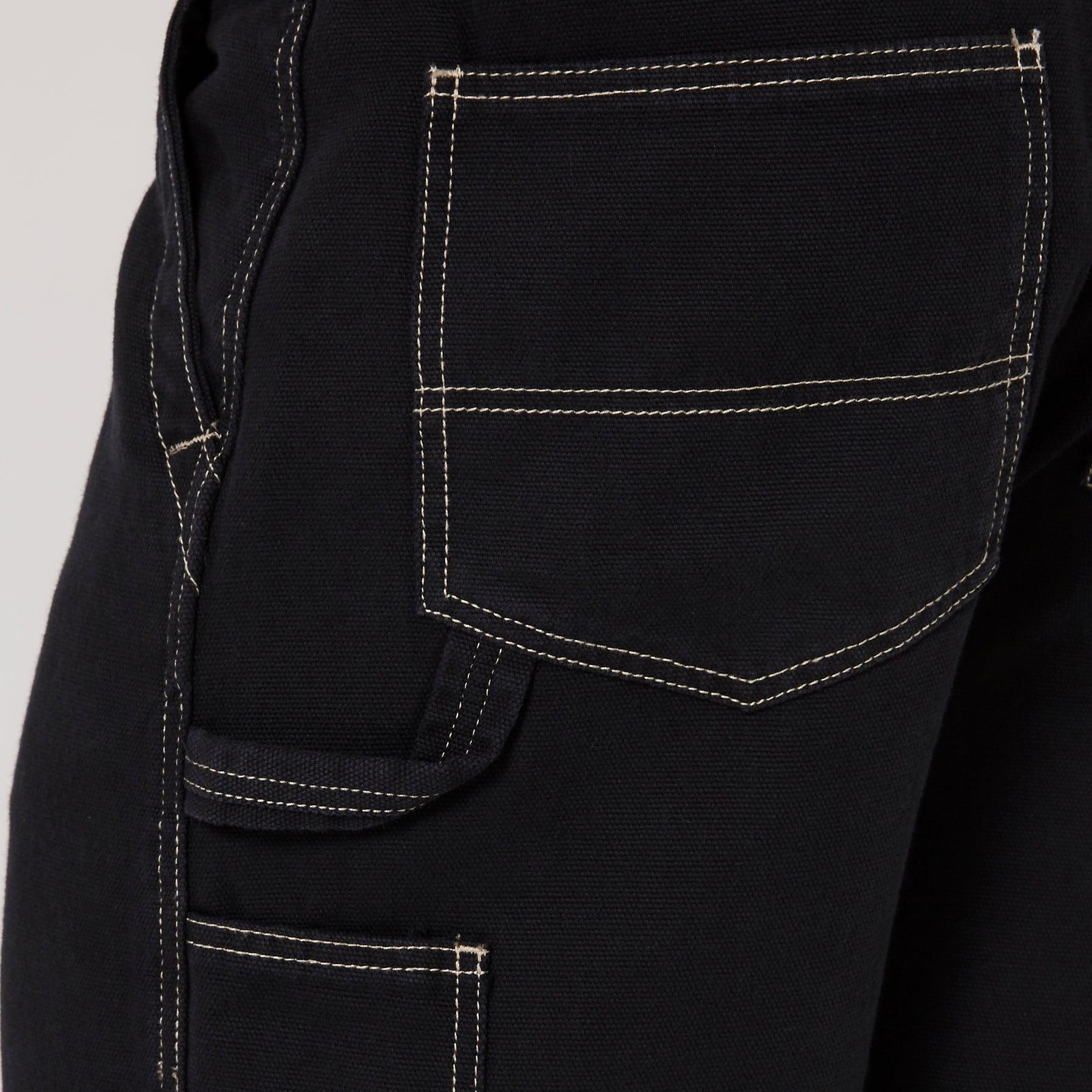 Close-up of black shorts stitching