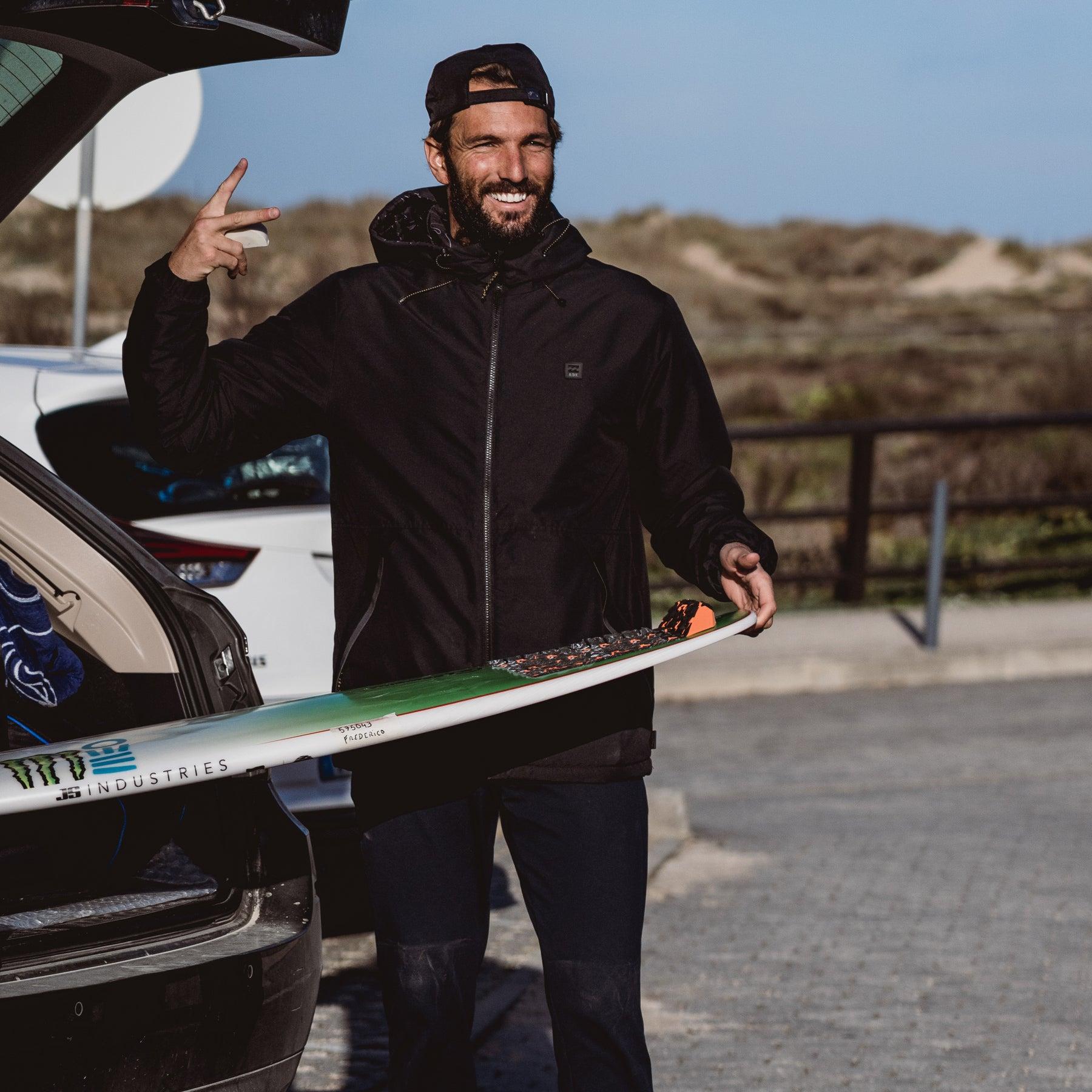 Surfer with Tail Pad on Beach