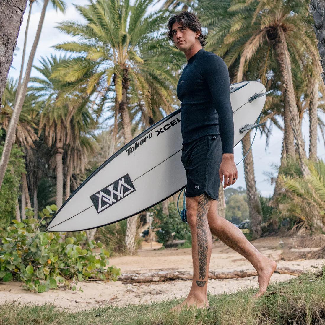 Man walking with surfboard