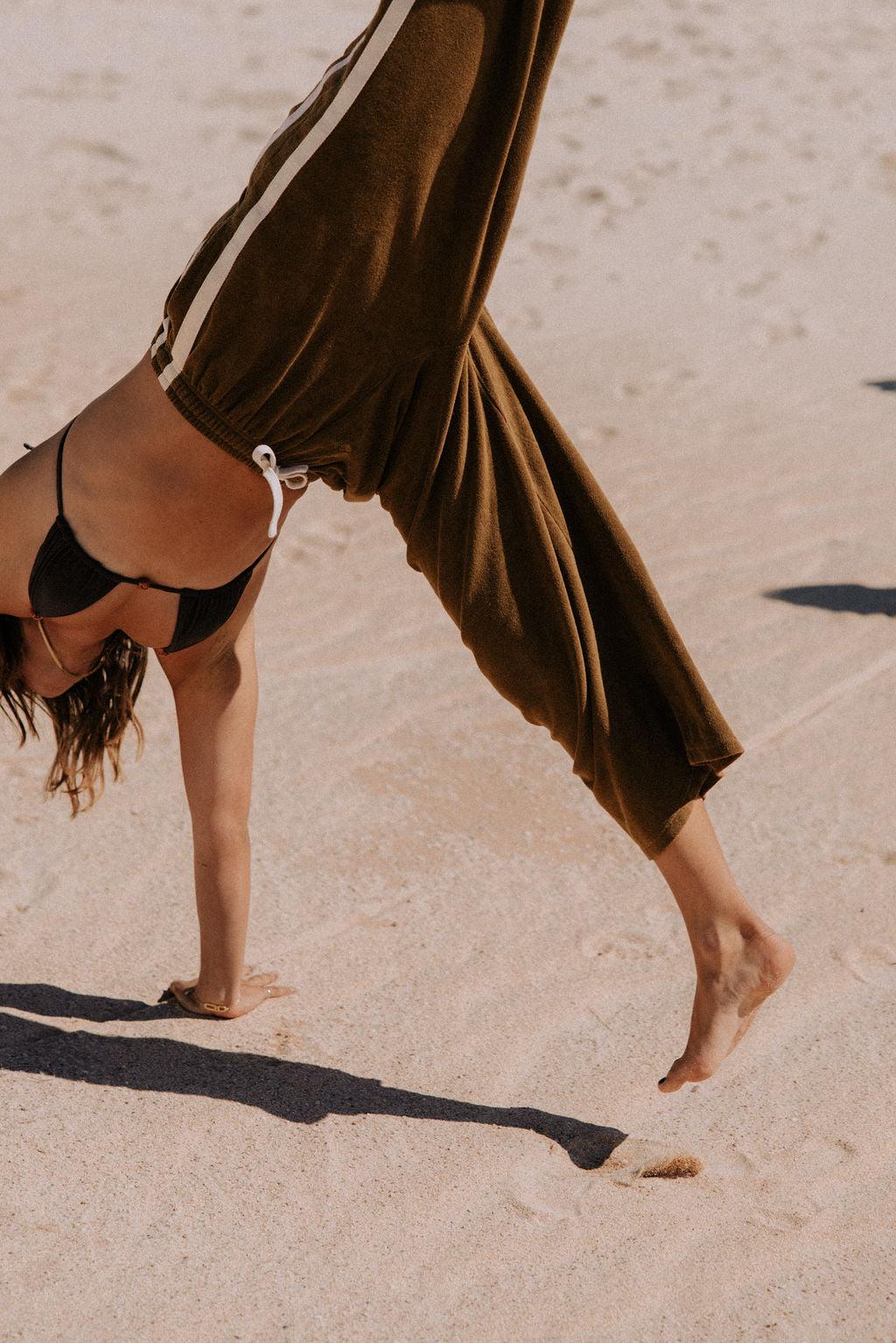 Green pants on model, side view