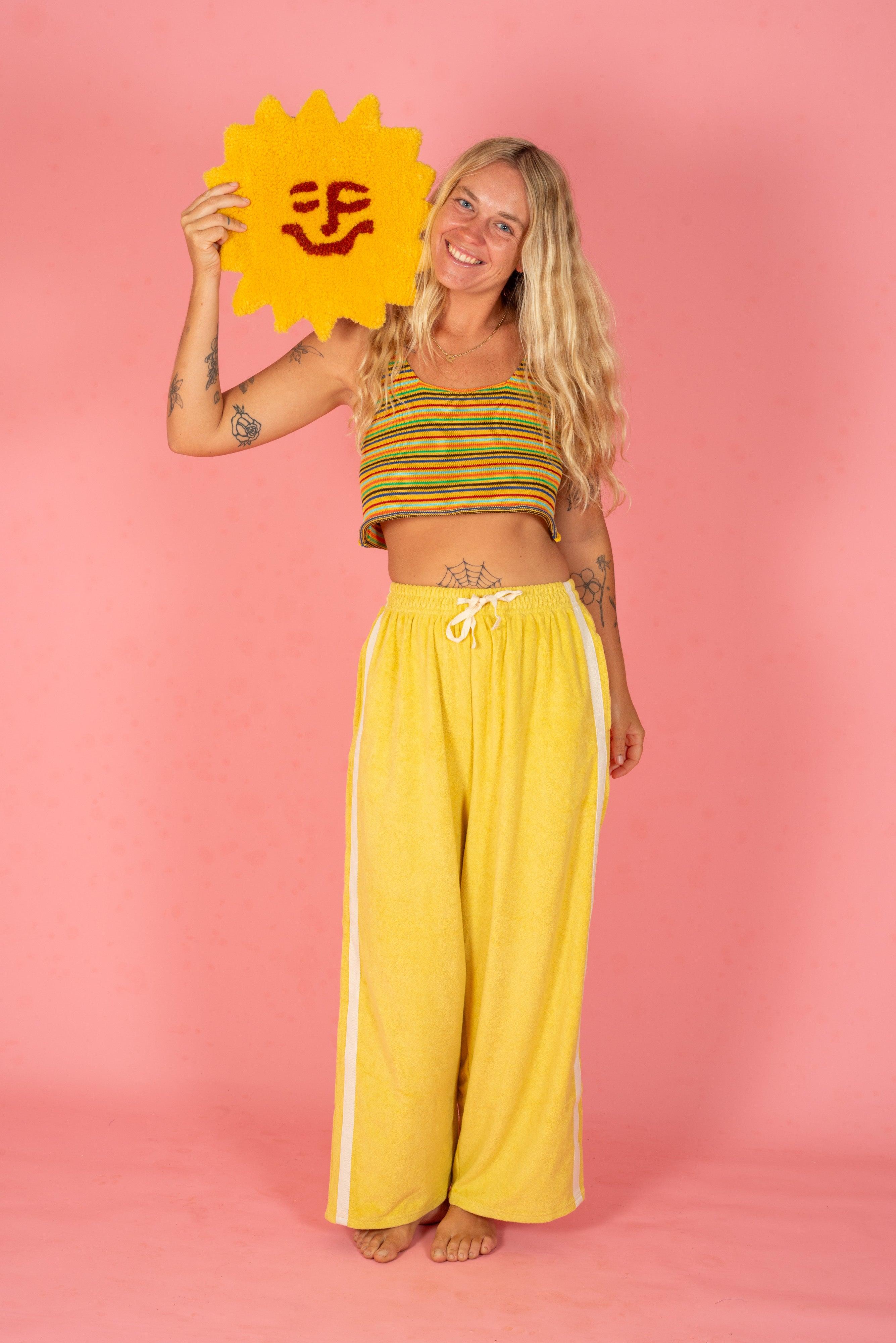 Yellow pants on pink background
