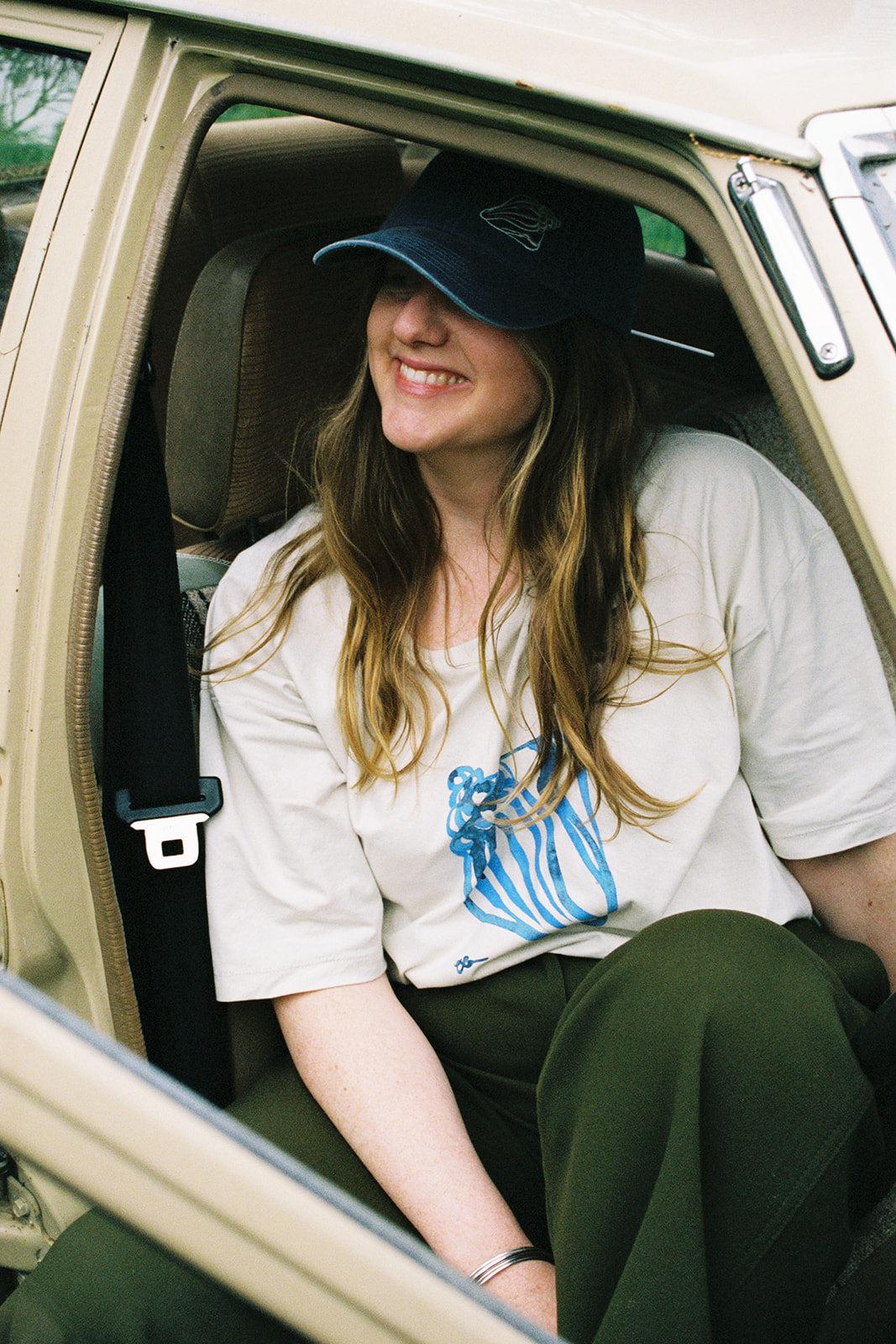 Tee sitting in car
