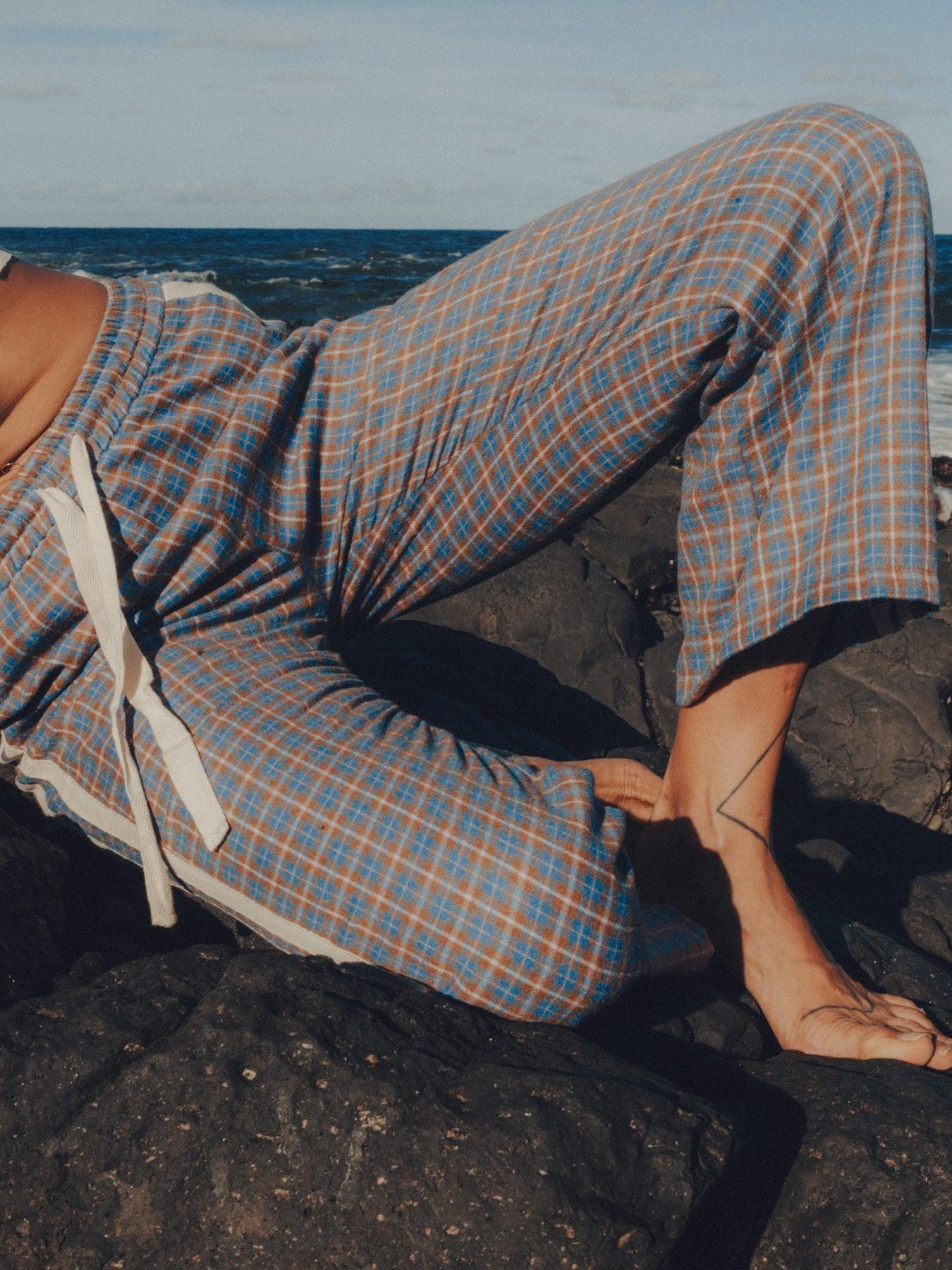 Flannel pants by car outdoors