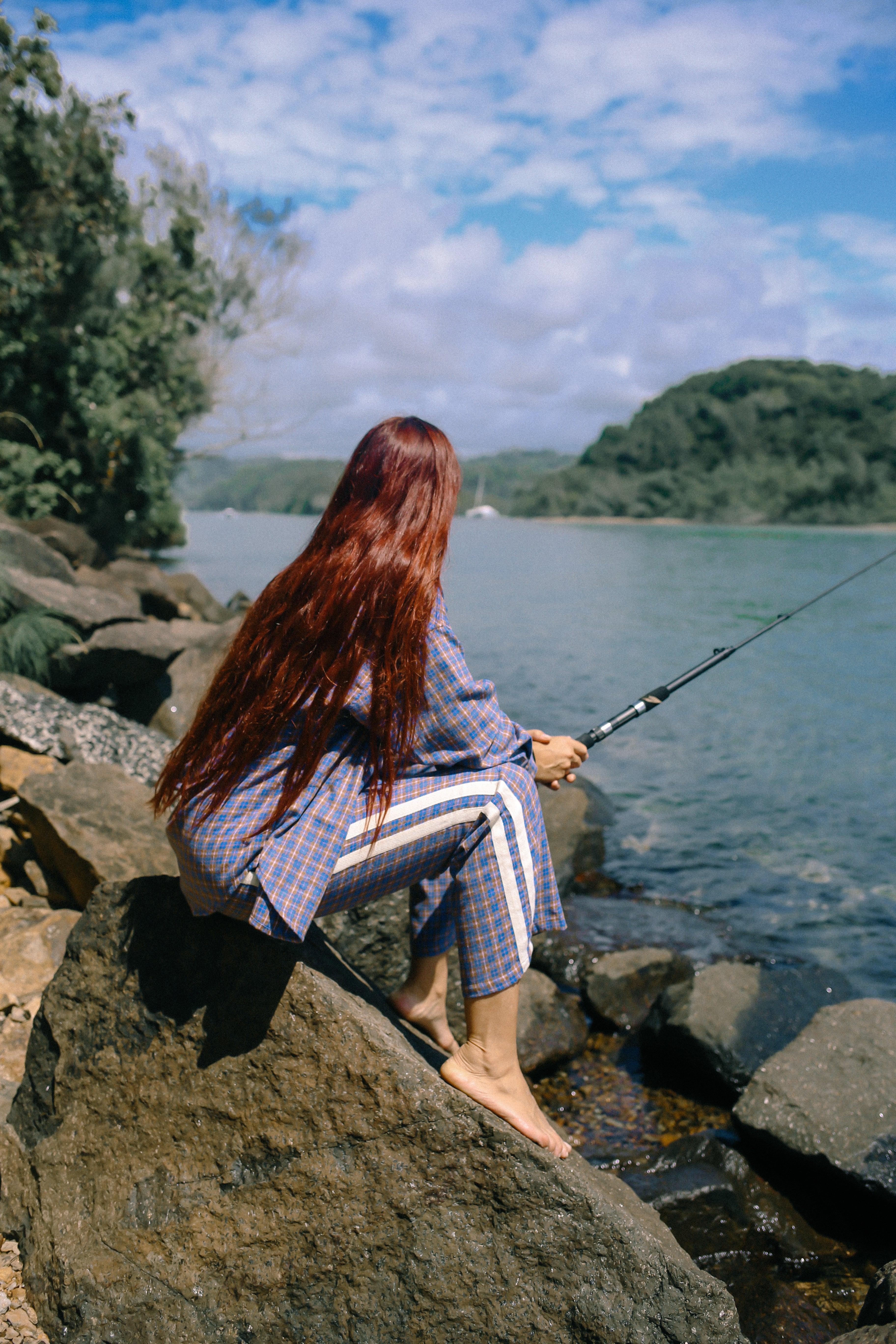 Flannel pants fishing by river