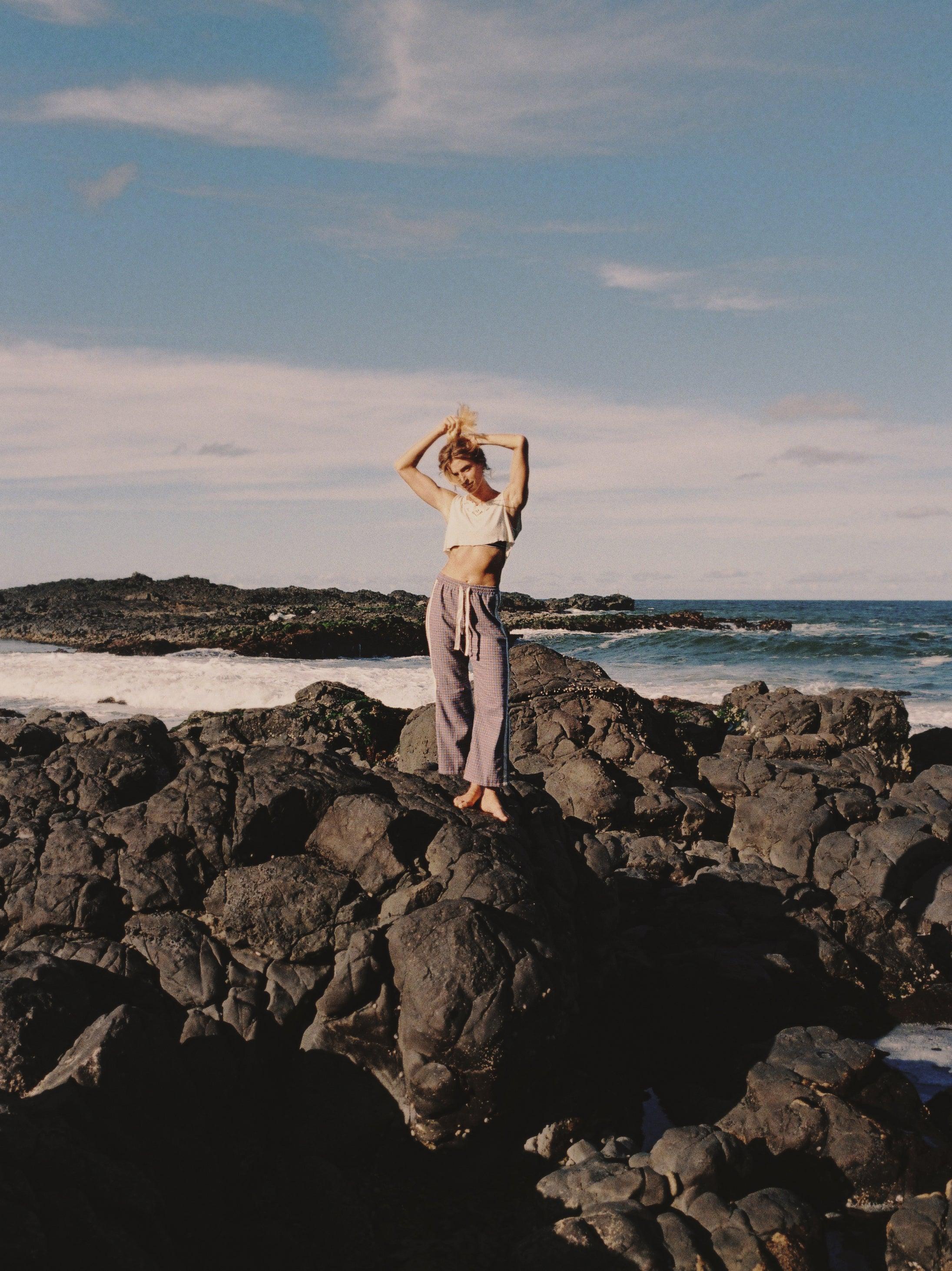 Flannel pants on rocks with sun