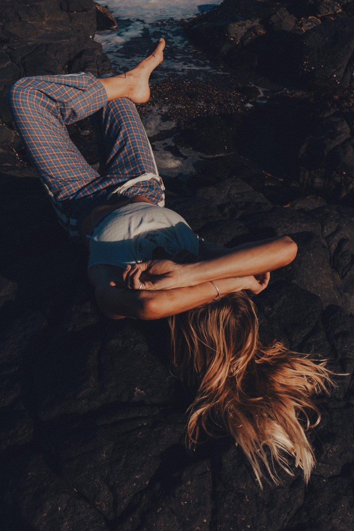 Flannel pants lying on rocks