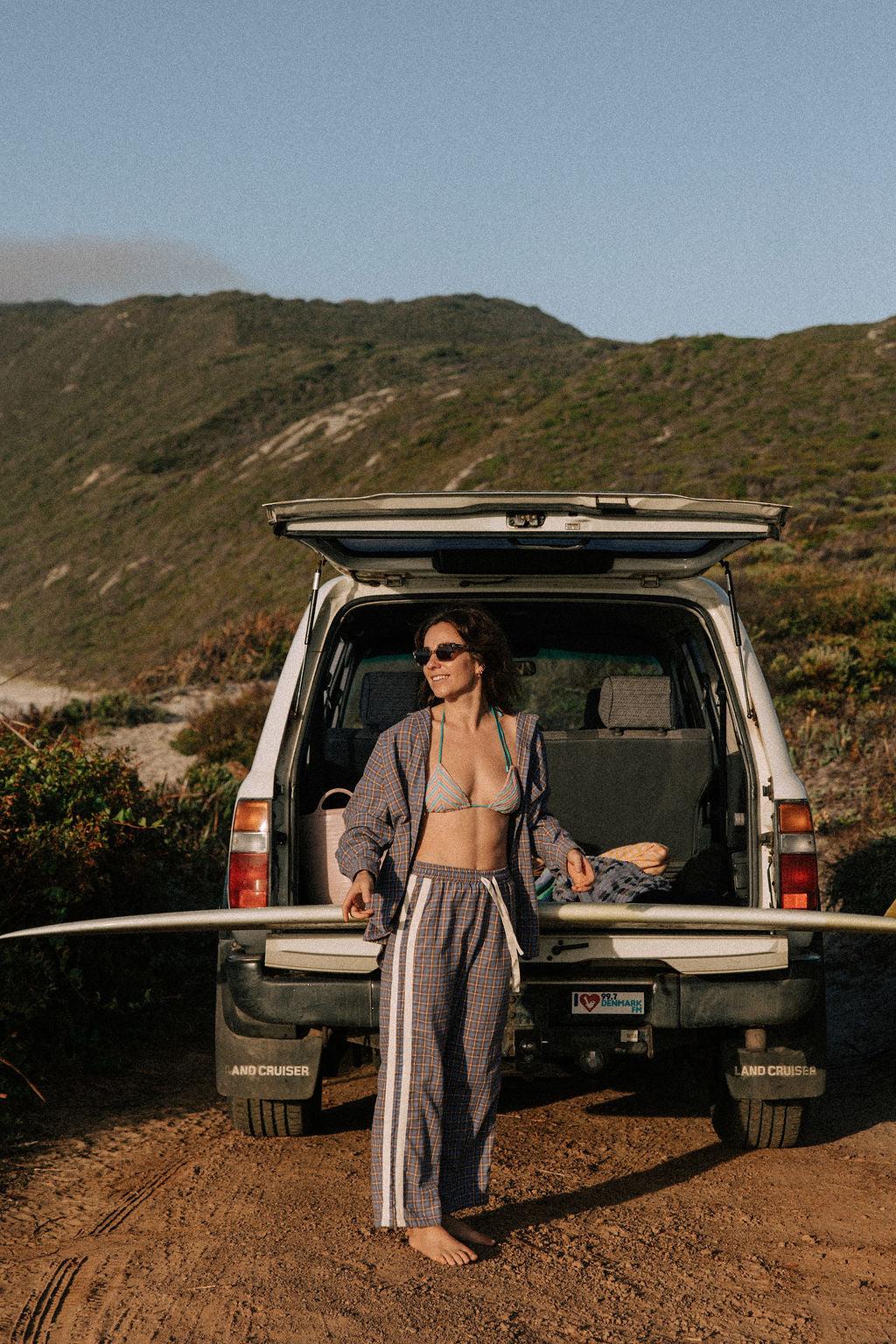 Flannel pants with surfboard