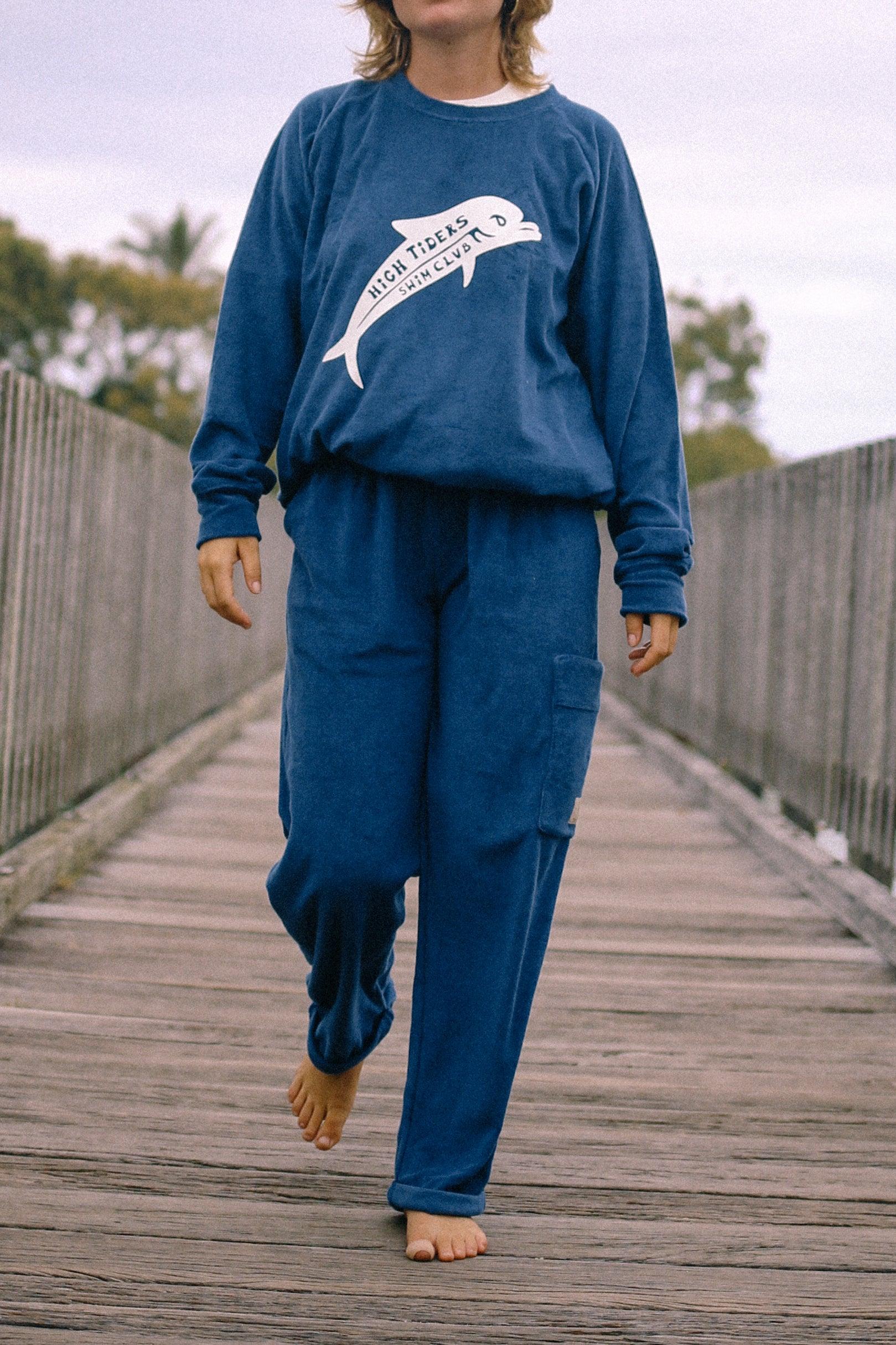 Sweater walking on bridge