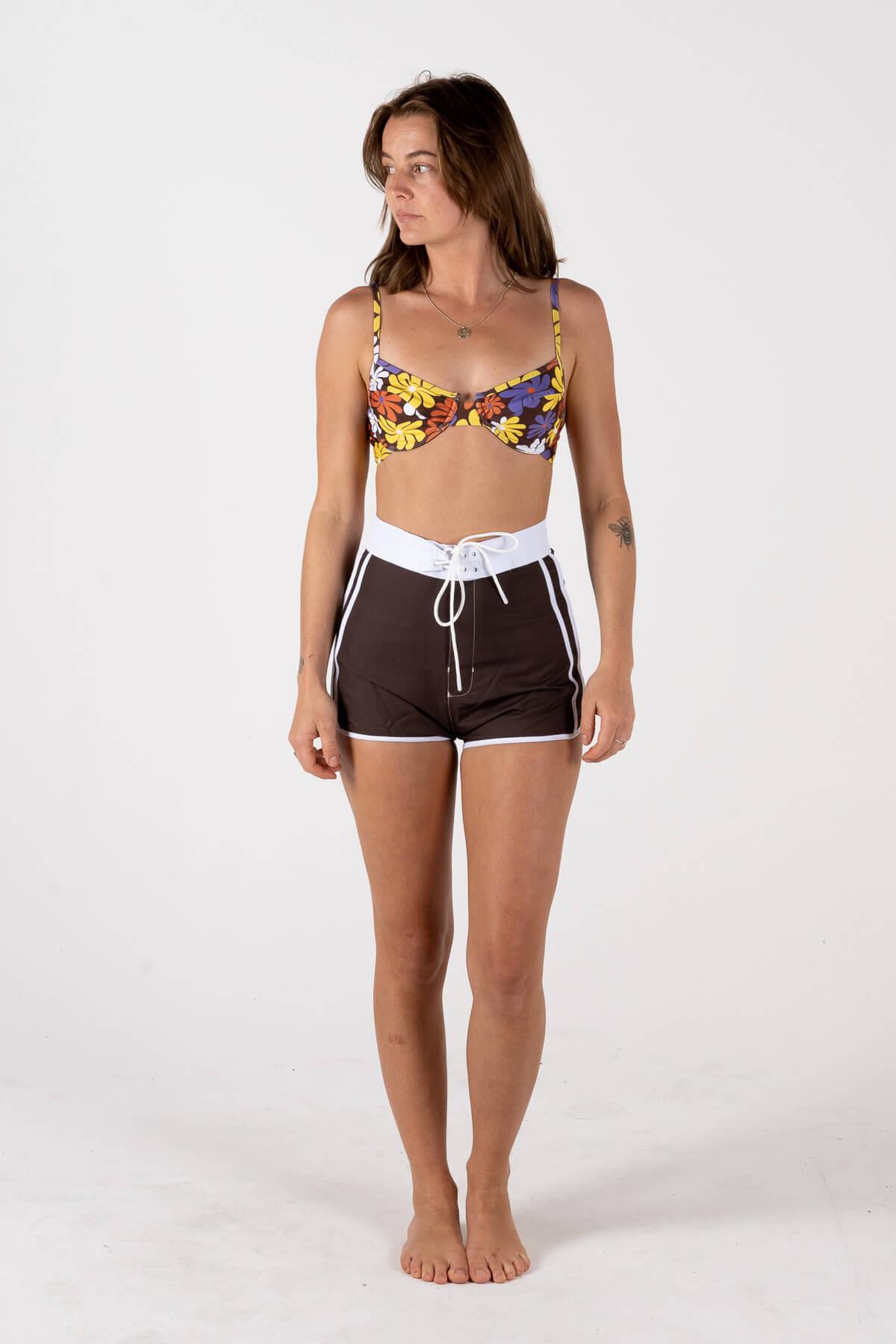 Front view of model wearing boardshorts
