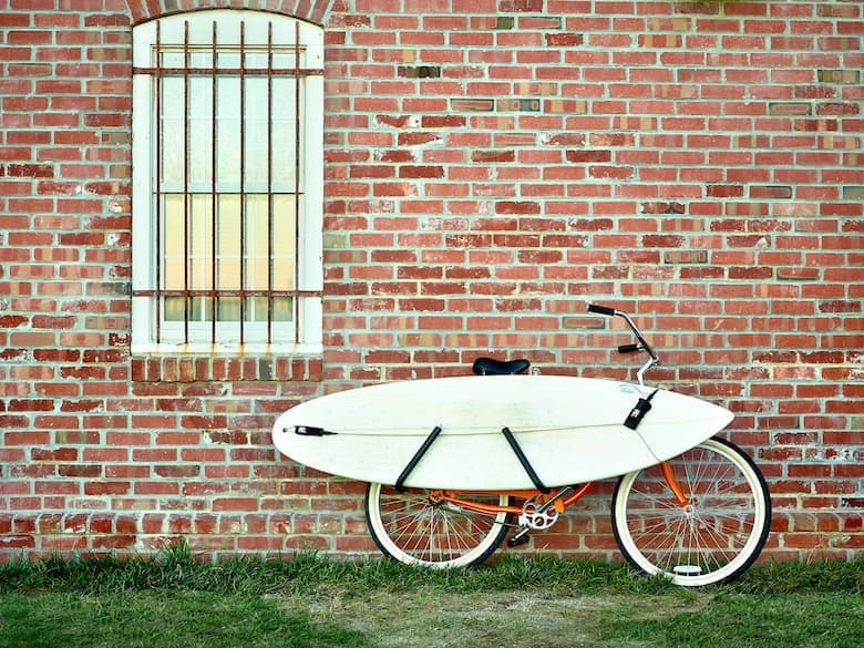 Moved by Bikes mbb shortboard surfboard bike rack holding surfboard brick wall