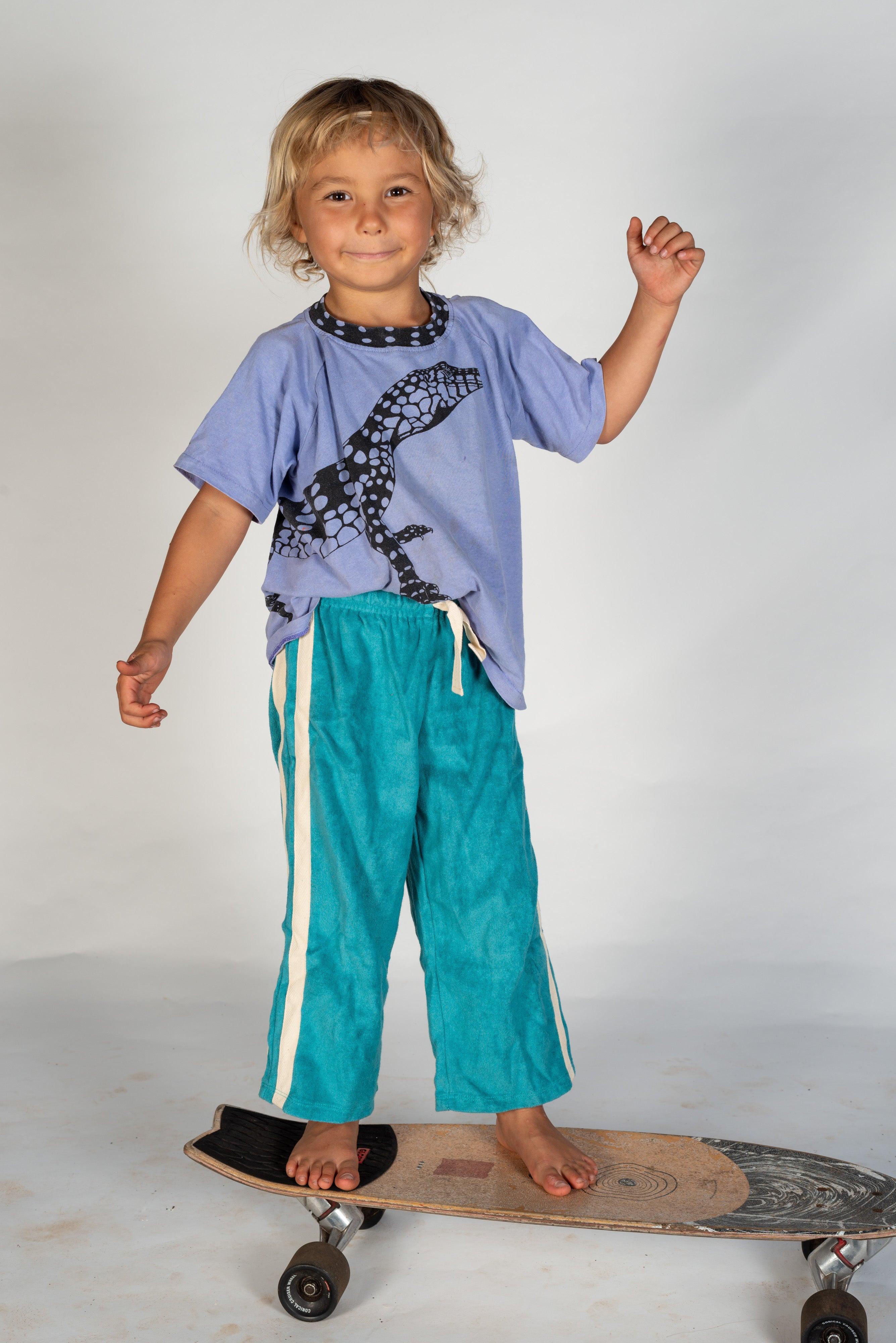 Child lying on skateboard