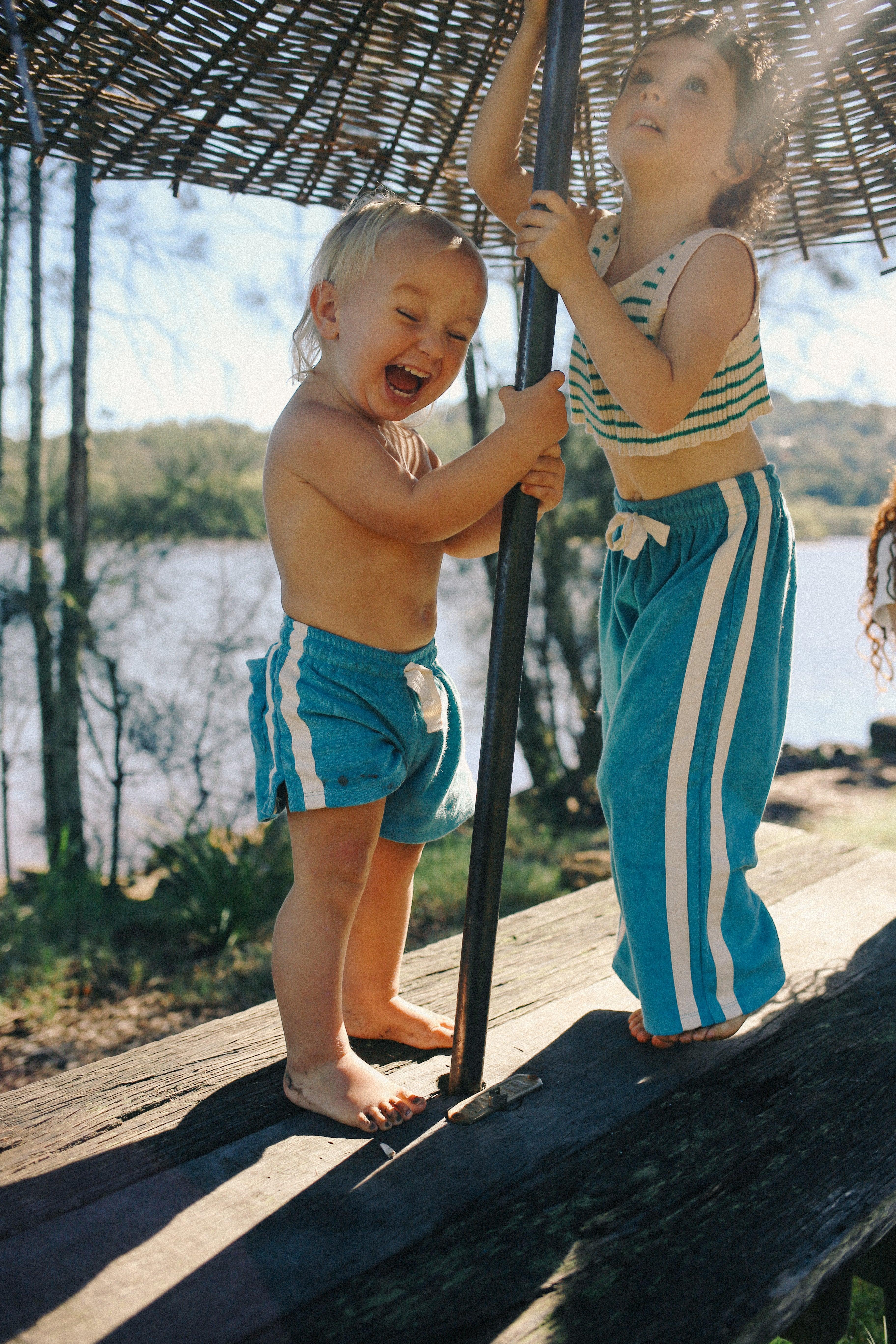 Child in blue pants on skateboard