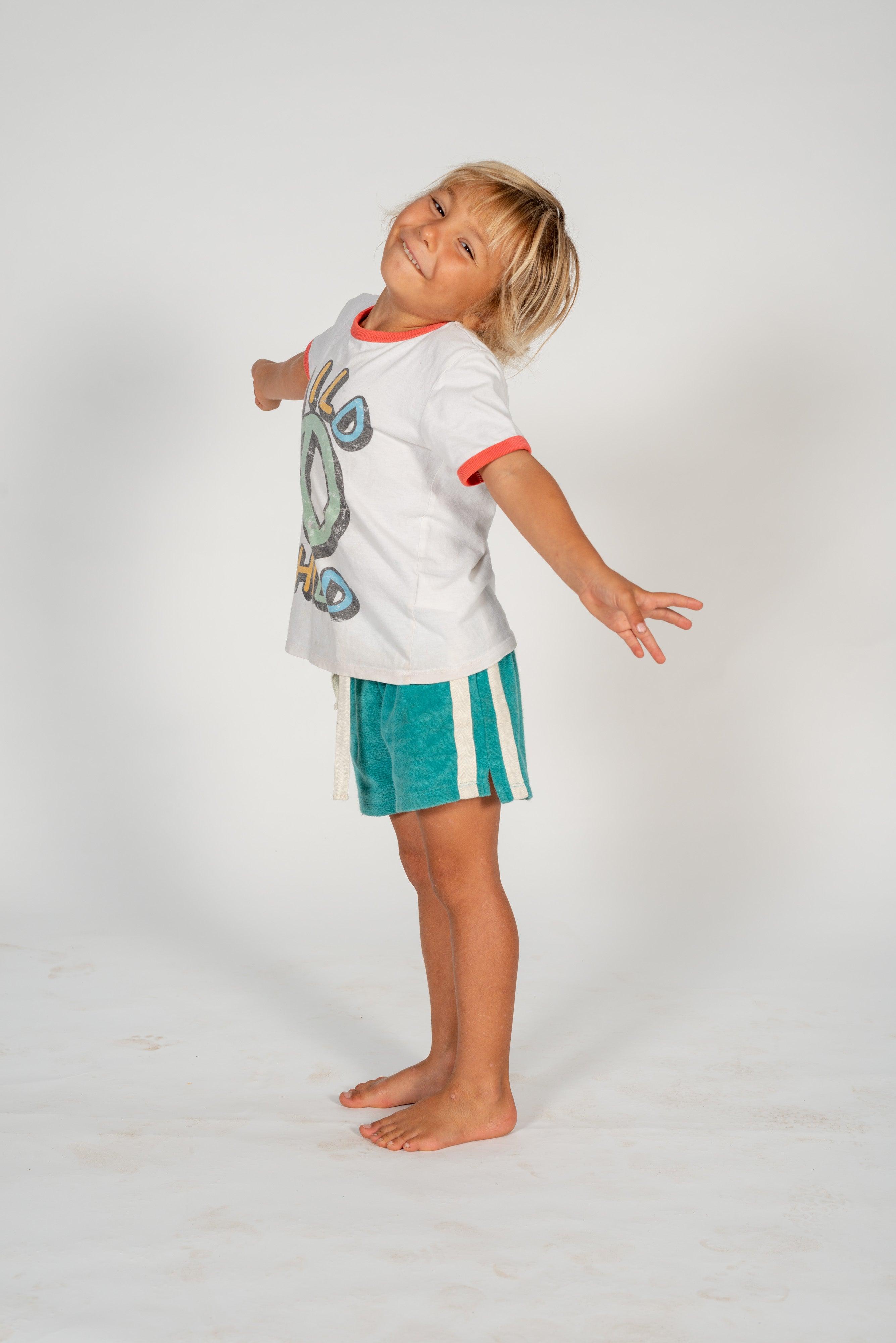 Child on skateboard standing