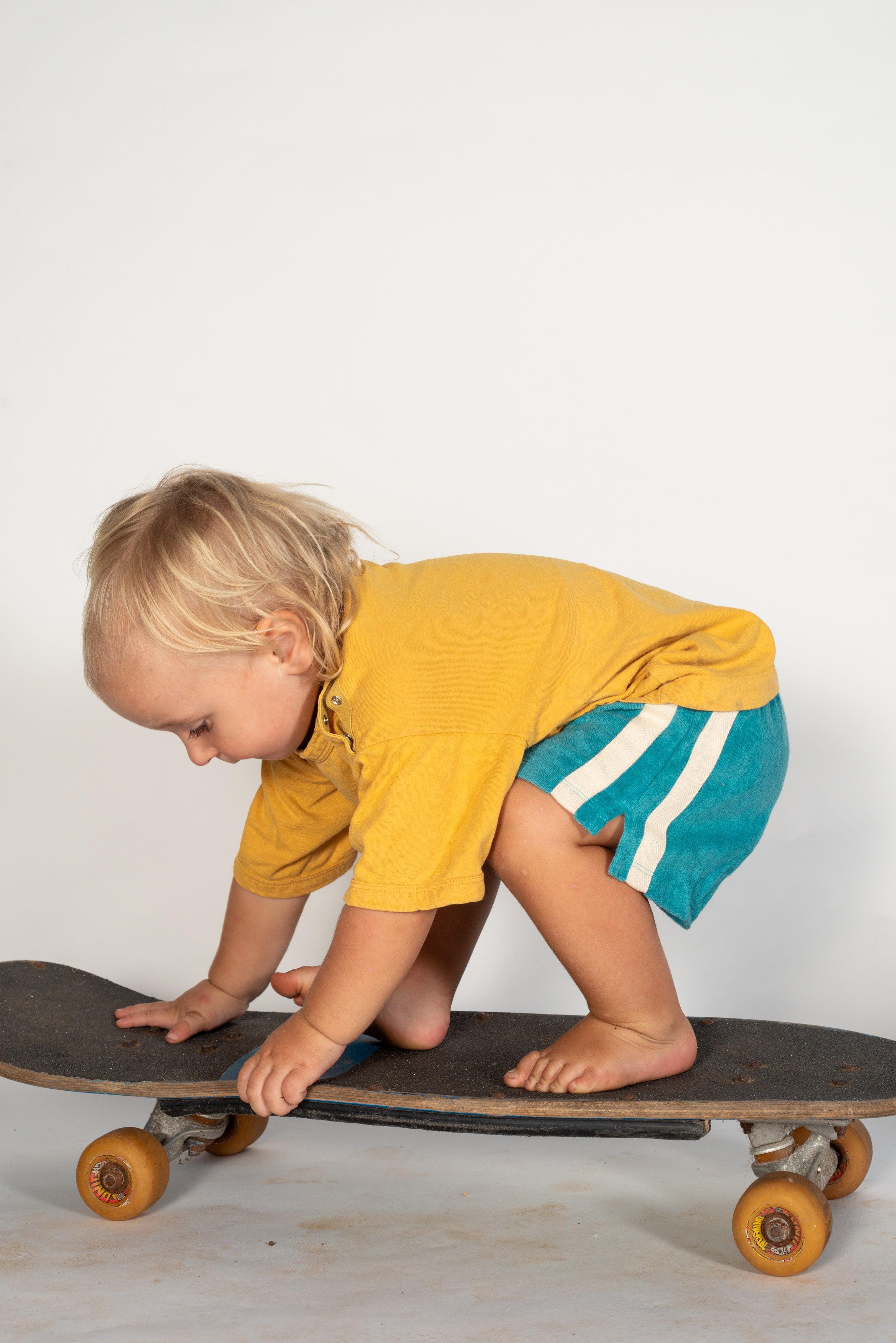 Child side view in shorts