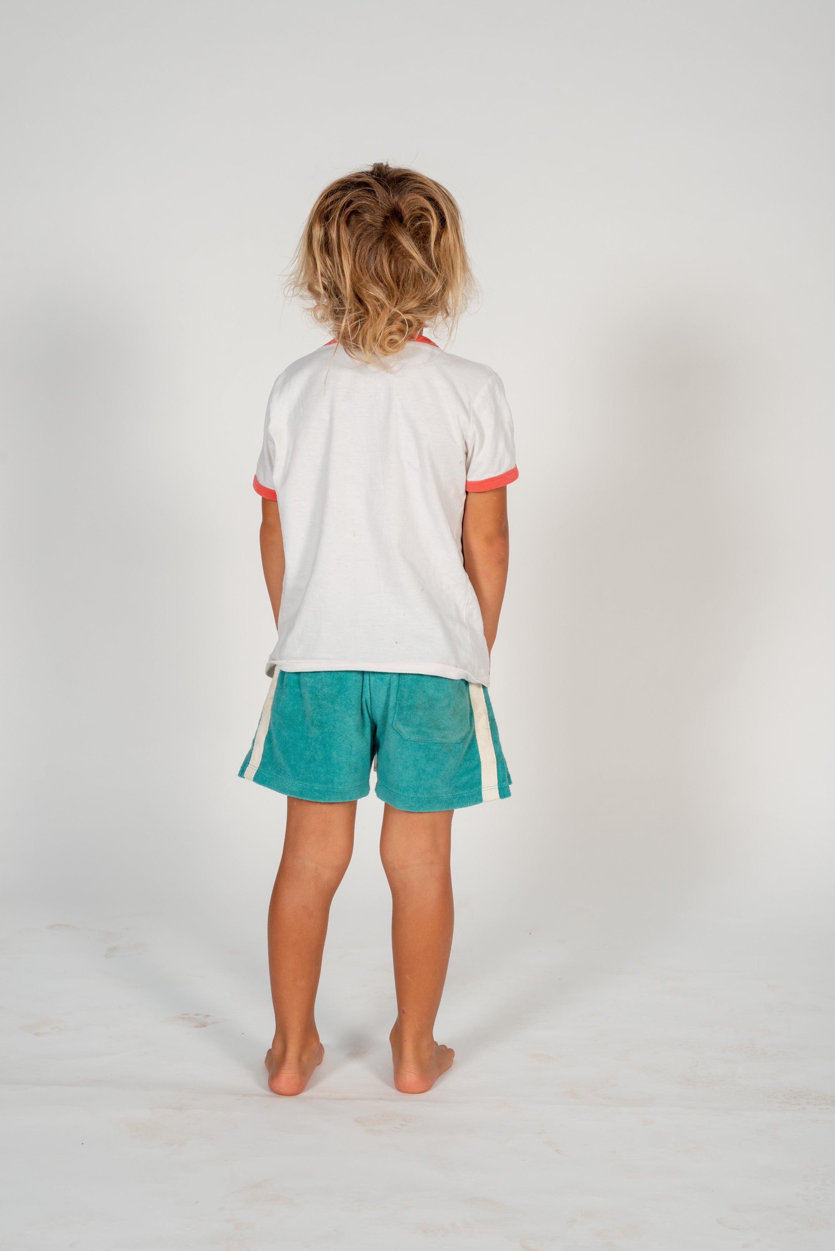 Child on skateboard crouching