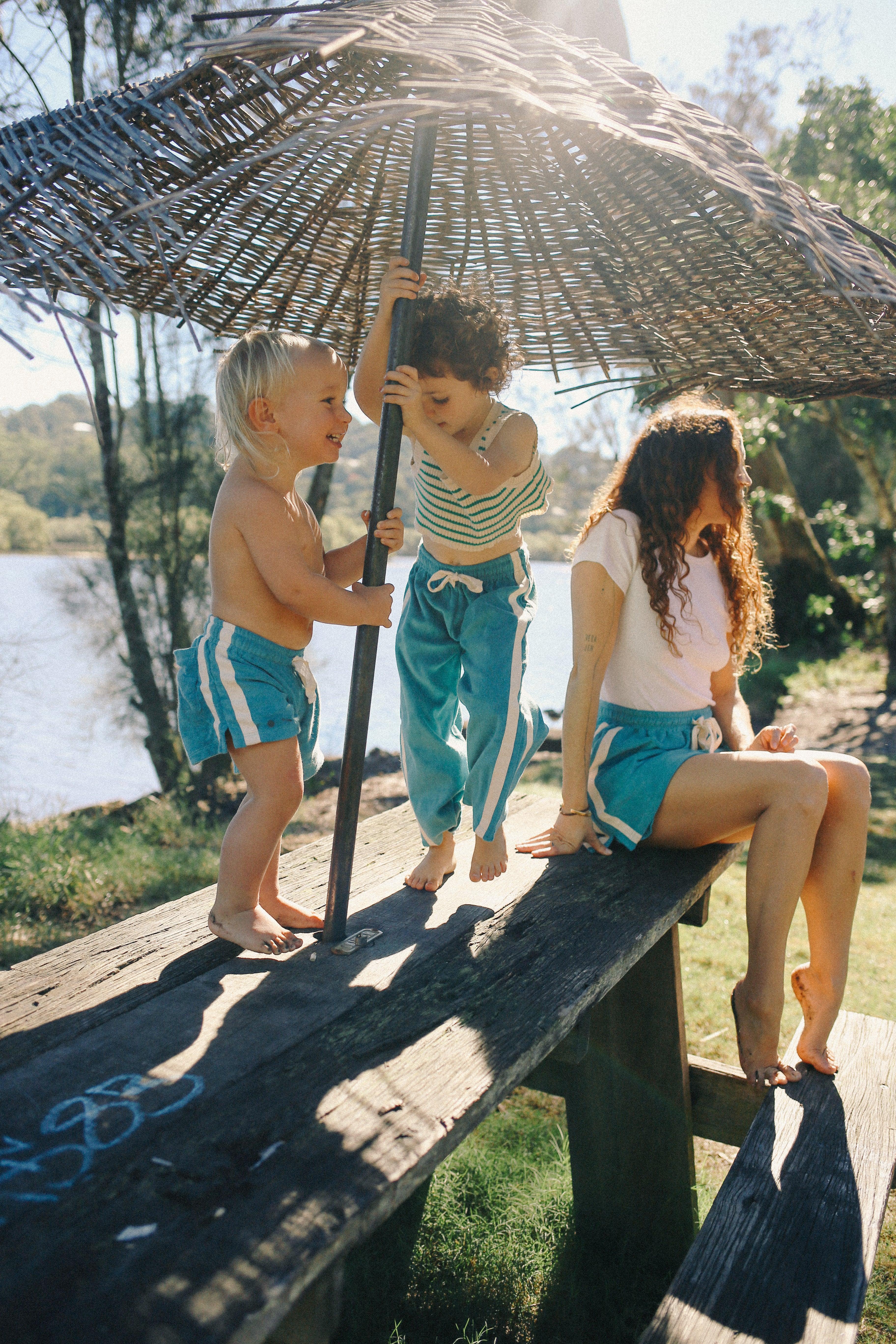 Children under umbrella outdoors