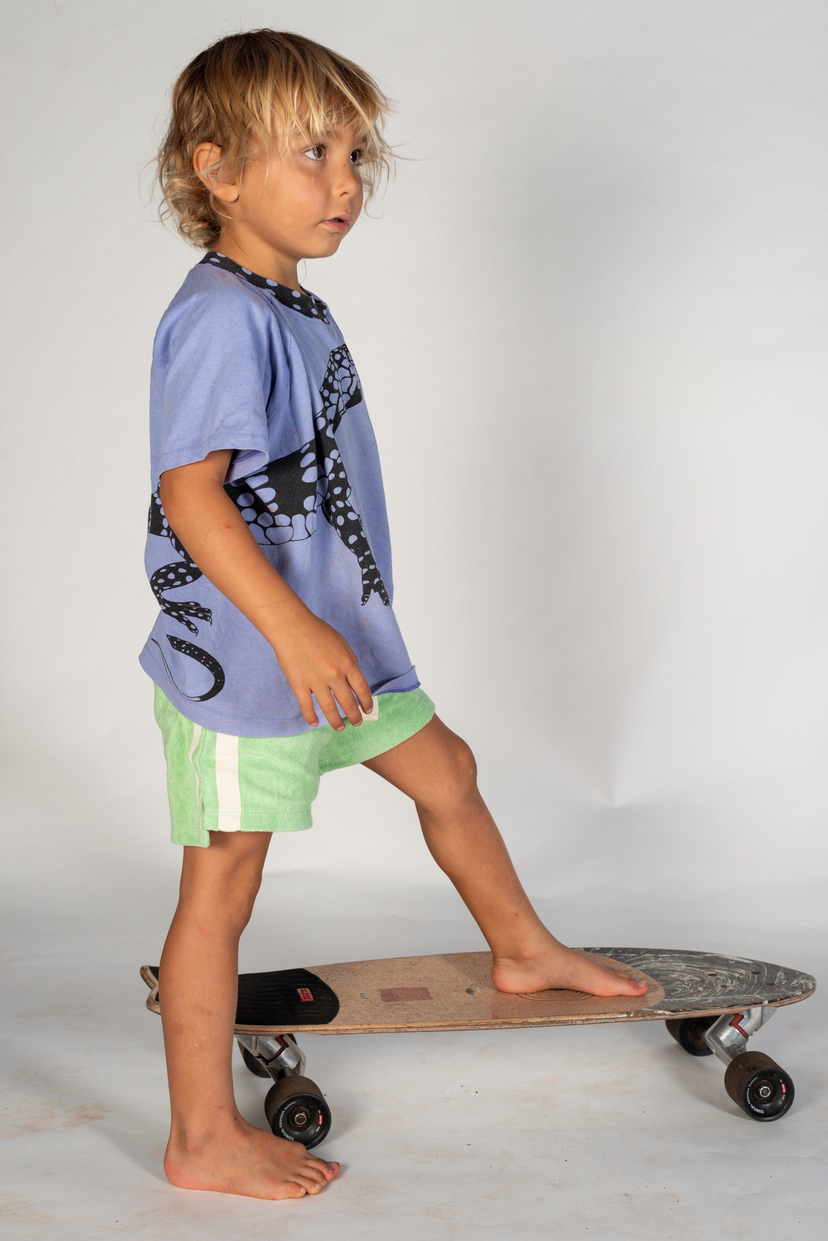 Mint shorts on skateboard stepping