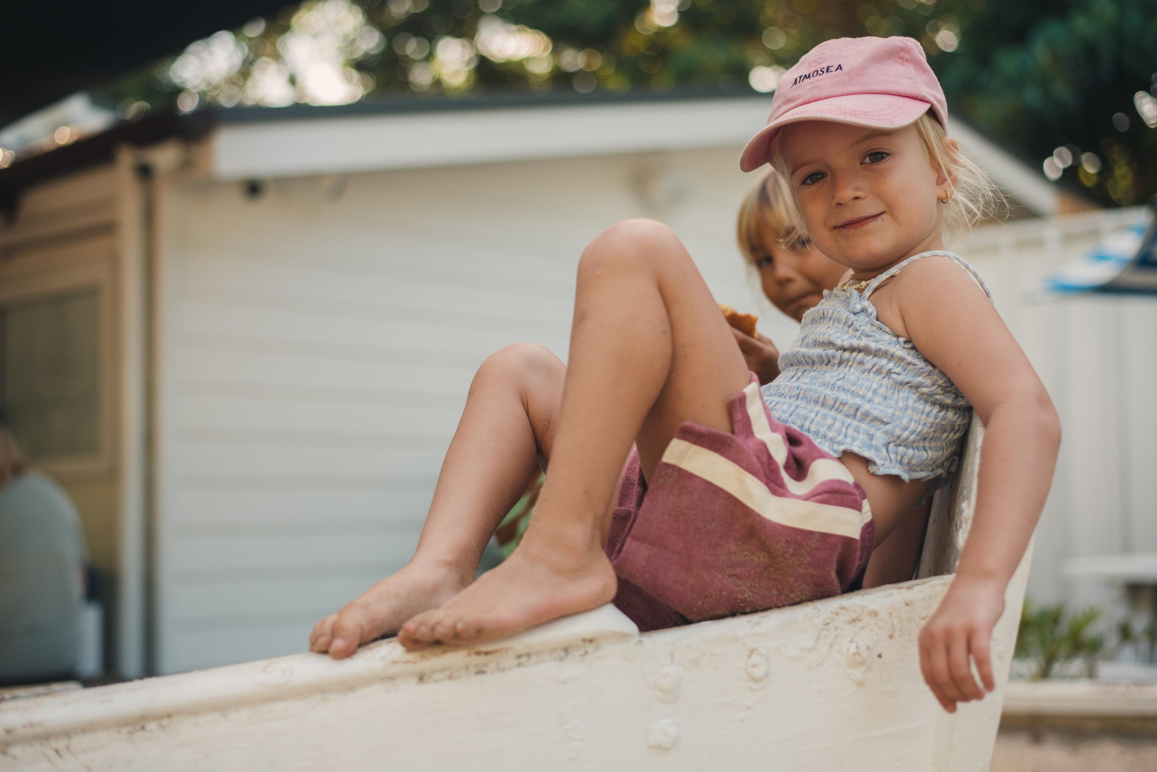 Child sitting on boat smiling