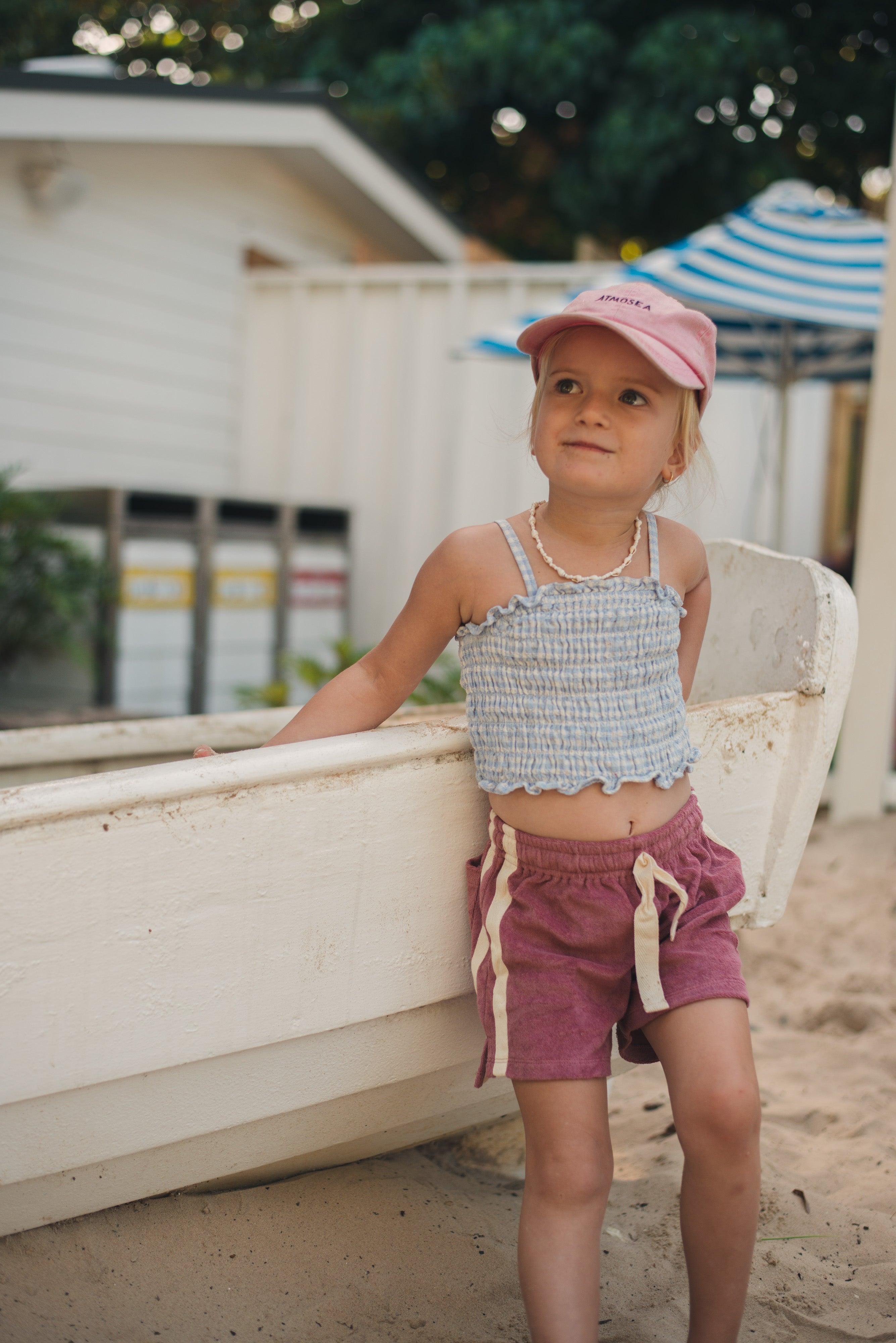 Child standing by boat
