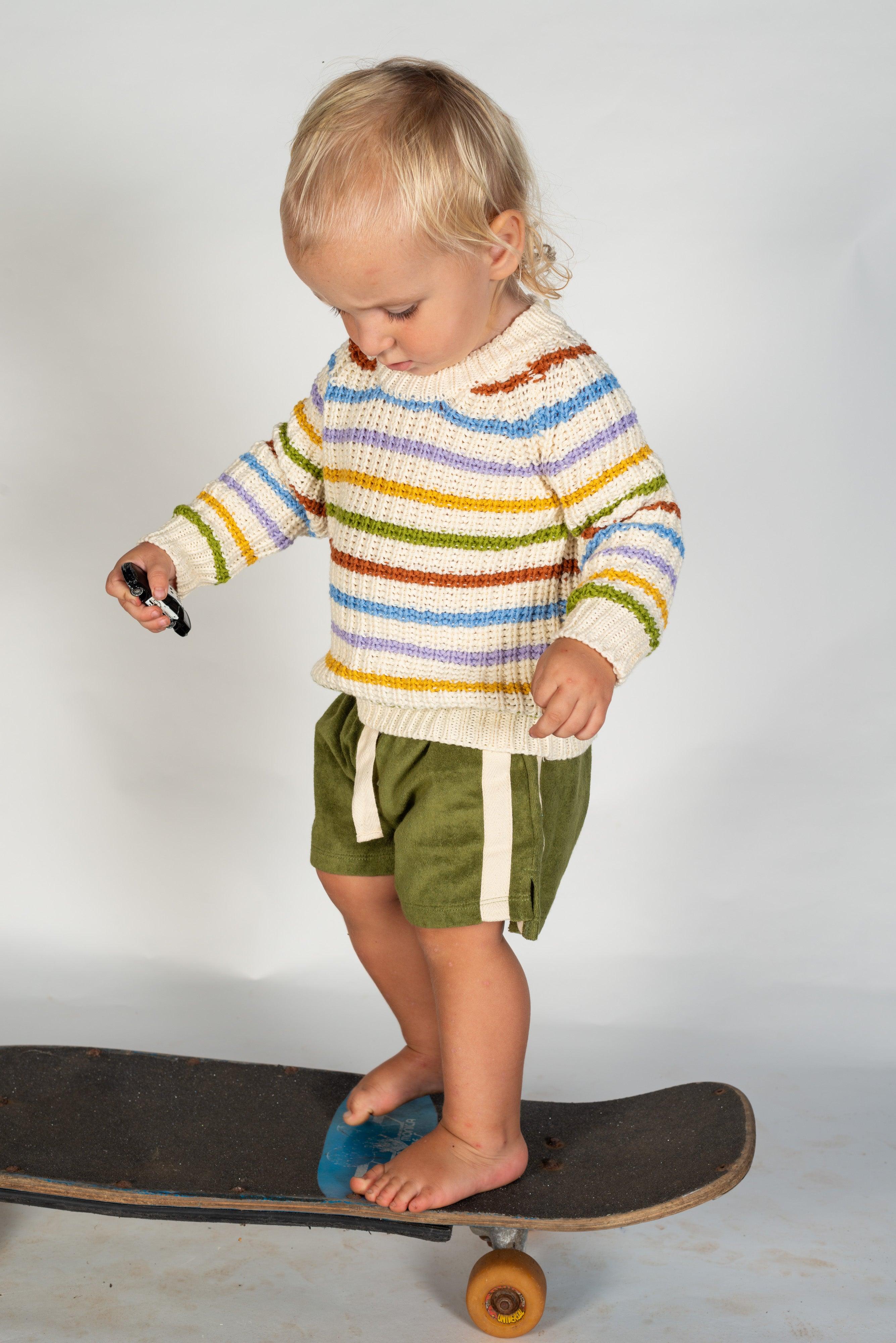 Toddler on skateboard