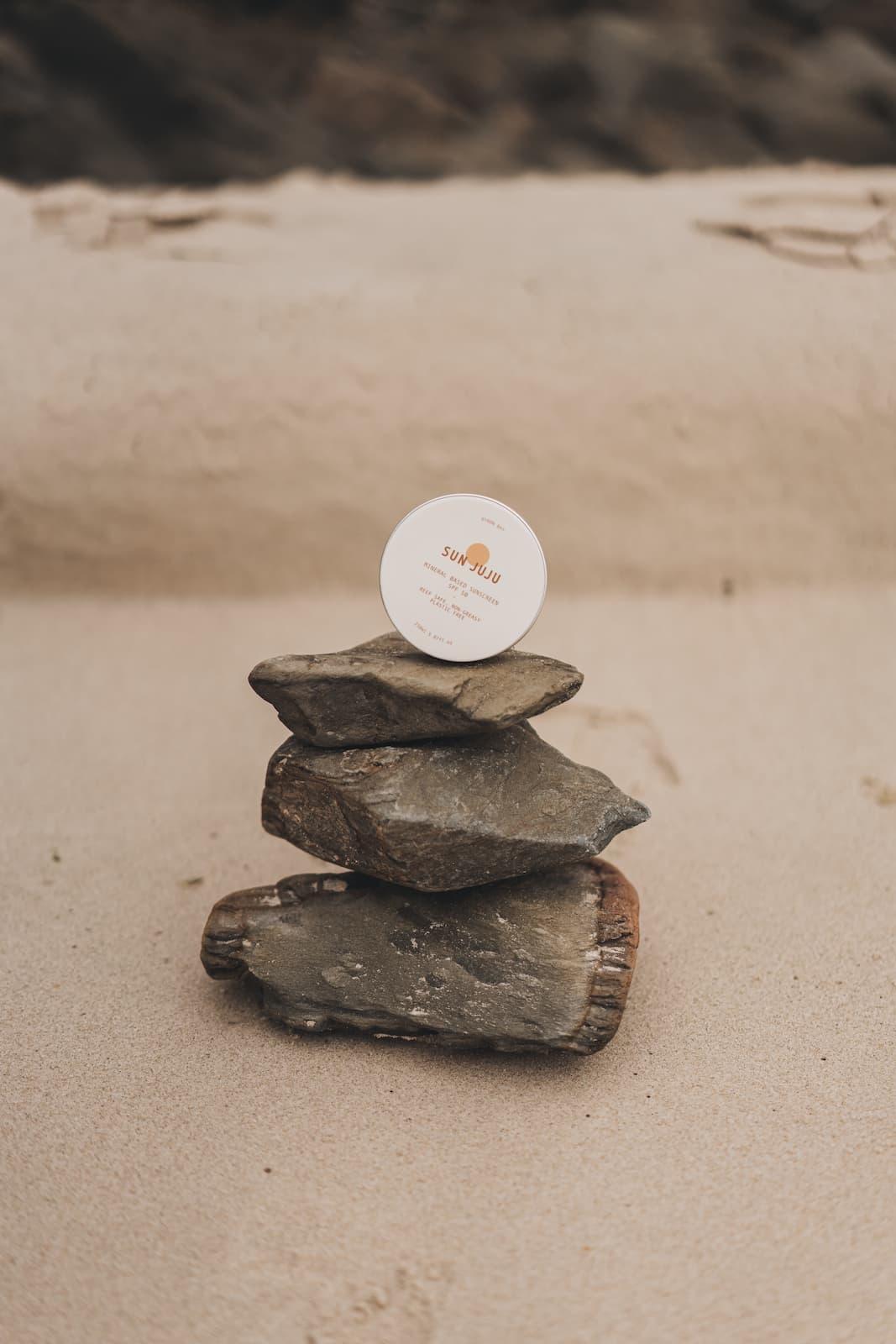 Sun Juju SPF50 Sunscreen on rocks