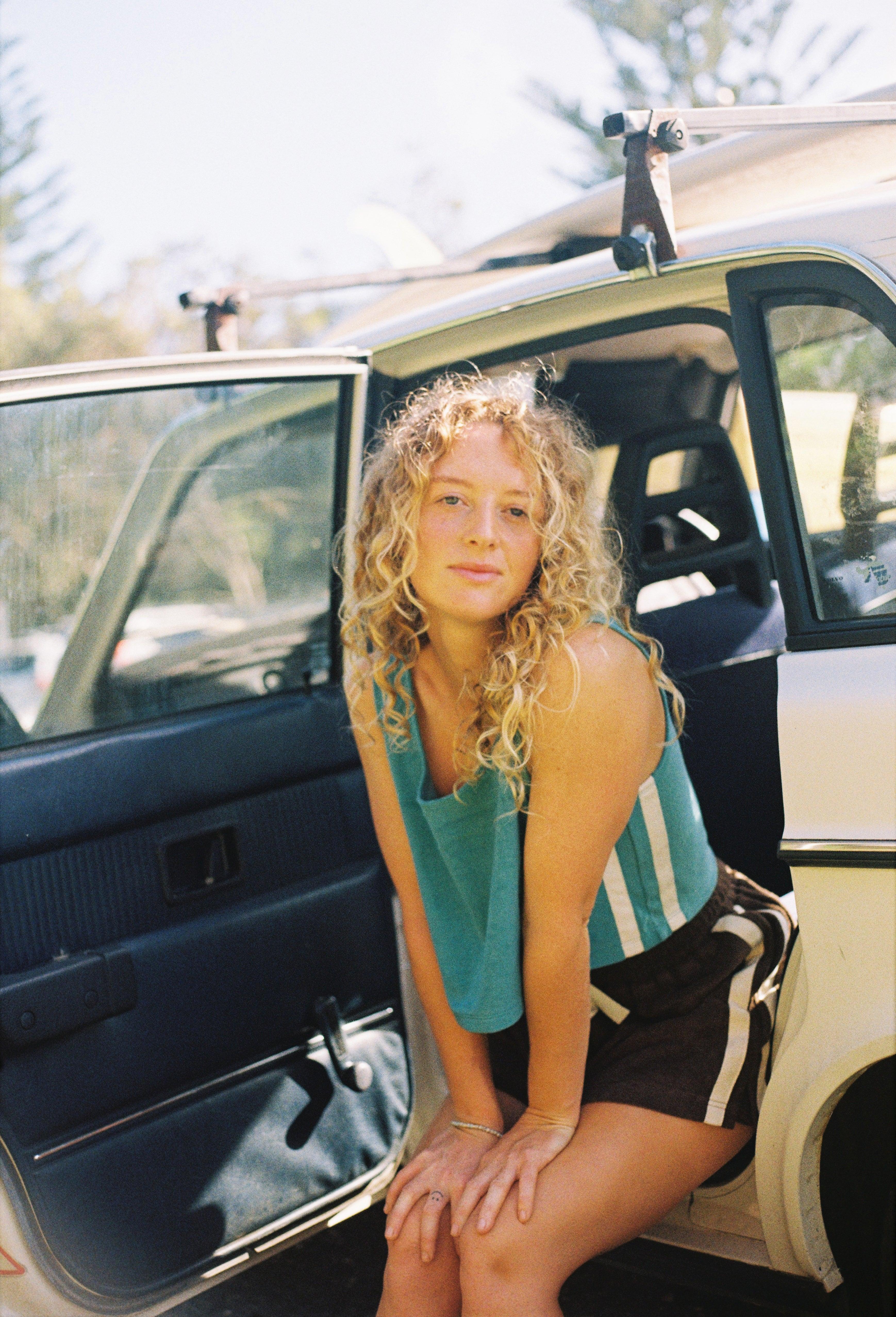 Model sitting in car door