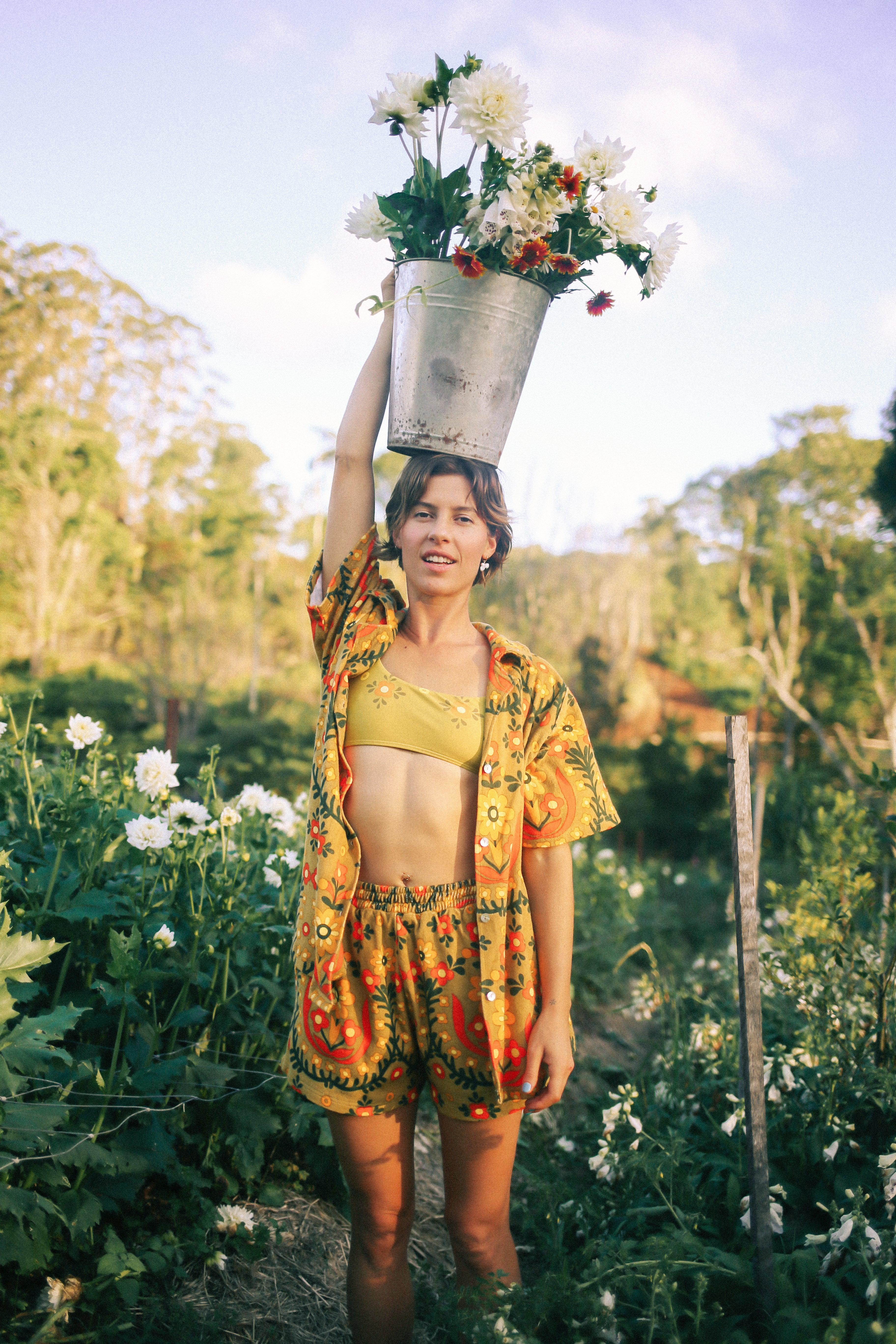 Model in garden with flowers