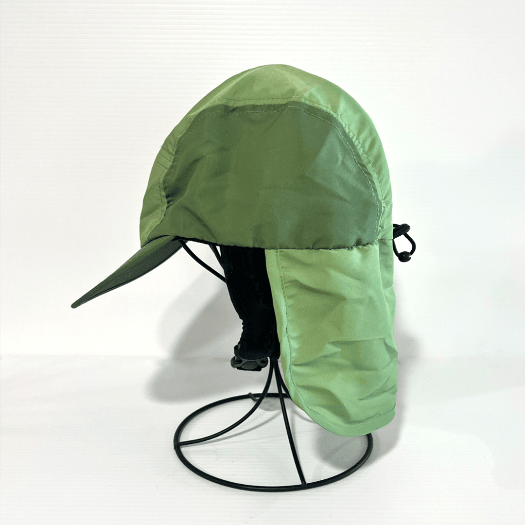 Side view of green surf cap