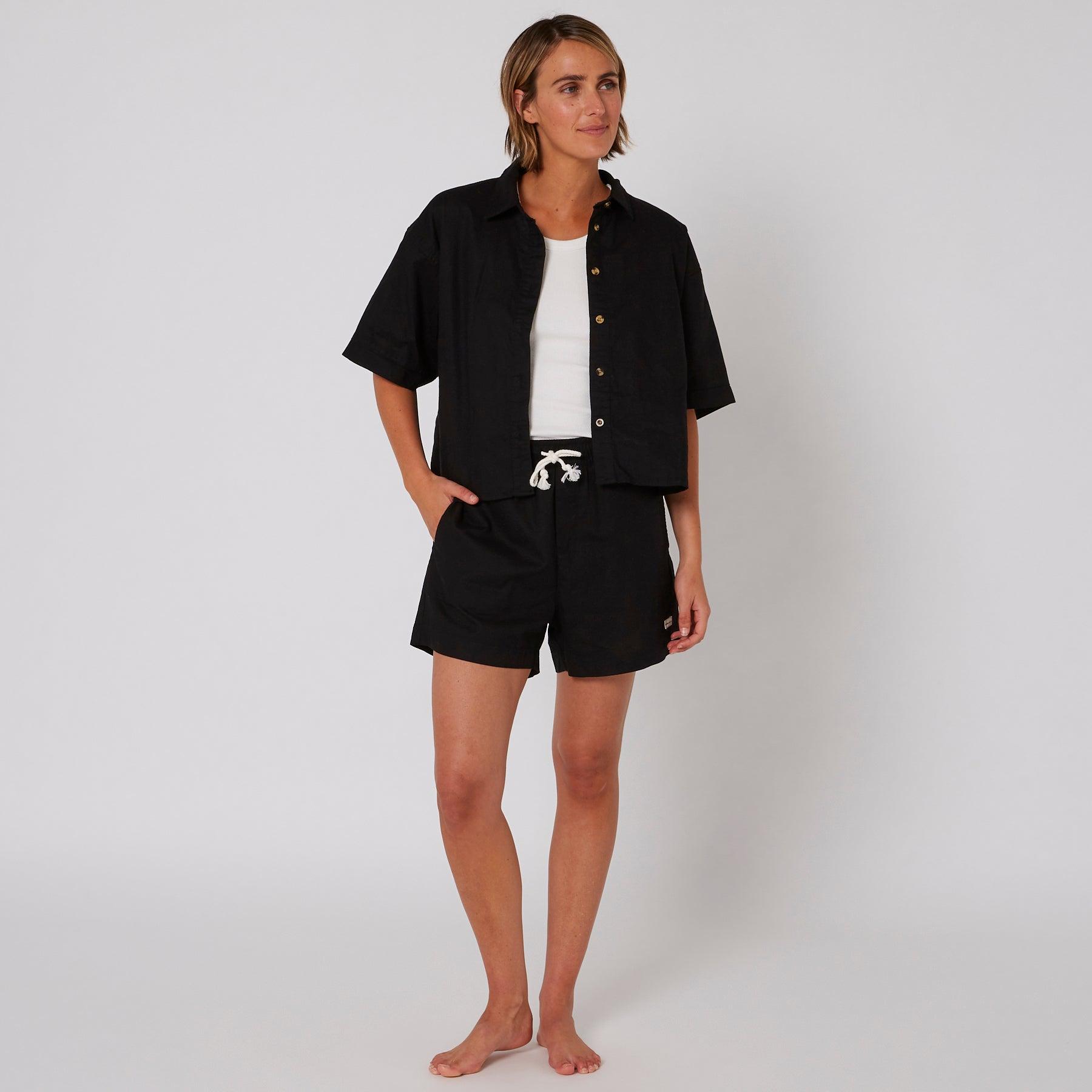 Model in full outfit with shorts