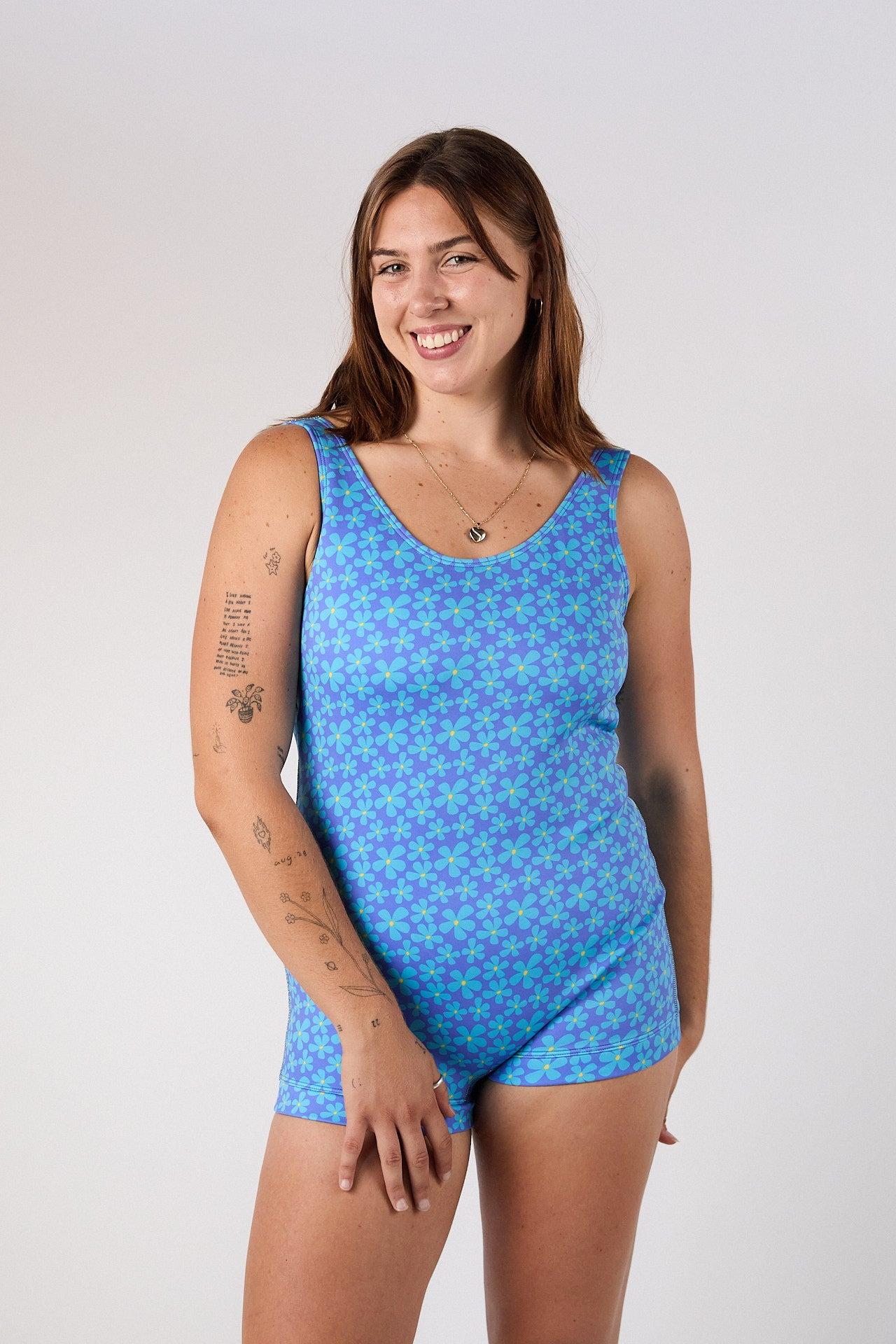 Model smiling in Lola Marine swimsuit