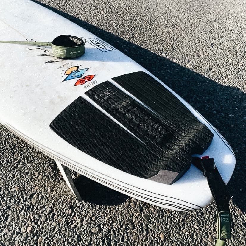 Tail pad on surfboard on beach