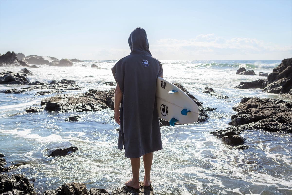 Curve Surf Poncho Towel - Microfiber back on model beach