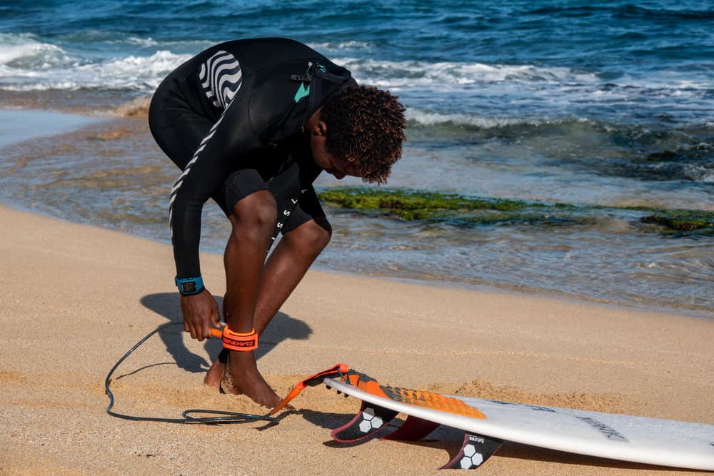 Dakine 7ft Kainui Team Leash - Shadow on model at beach