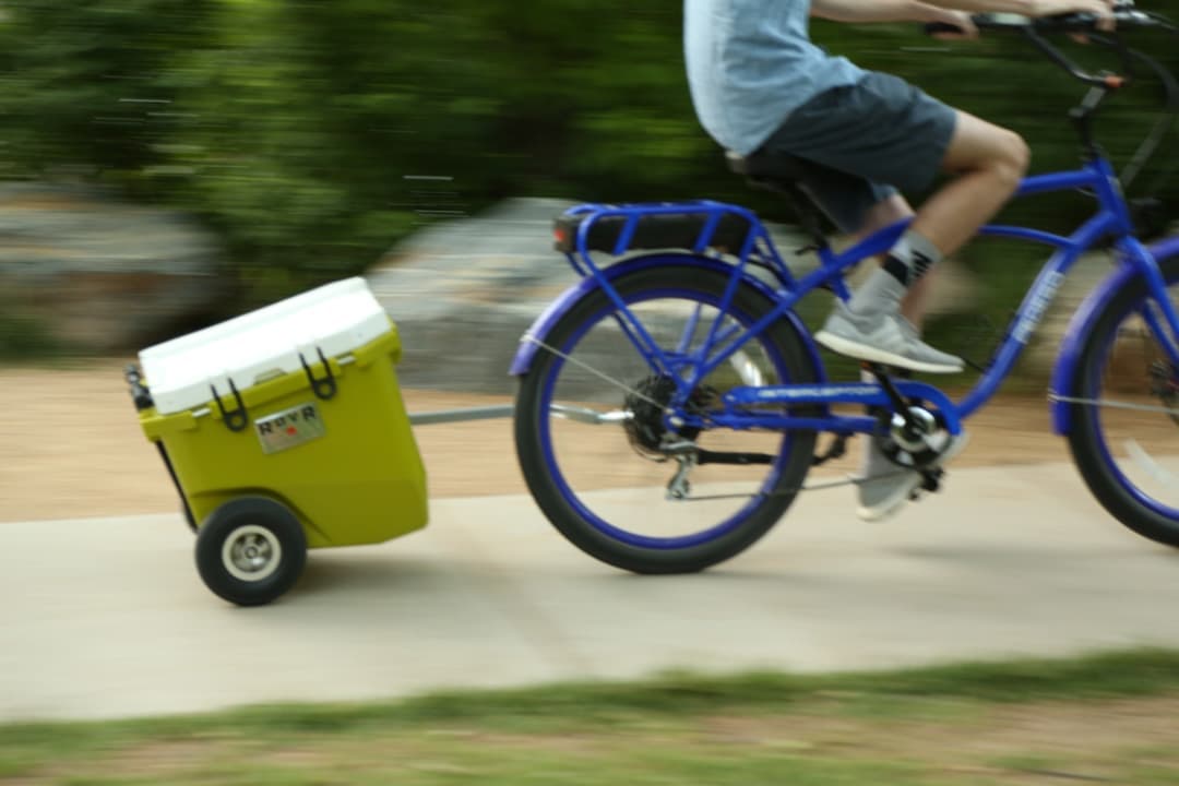 ROVR RollR 45 Cooler - Moss towed by bike