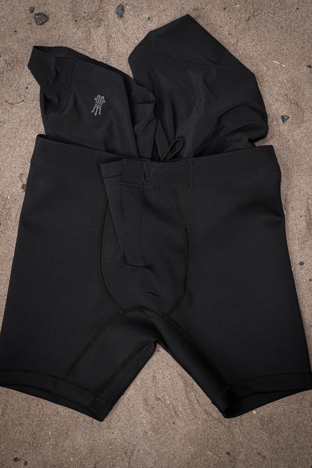 Boardshorts flat lay on sand