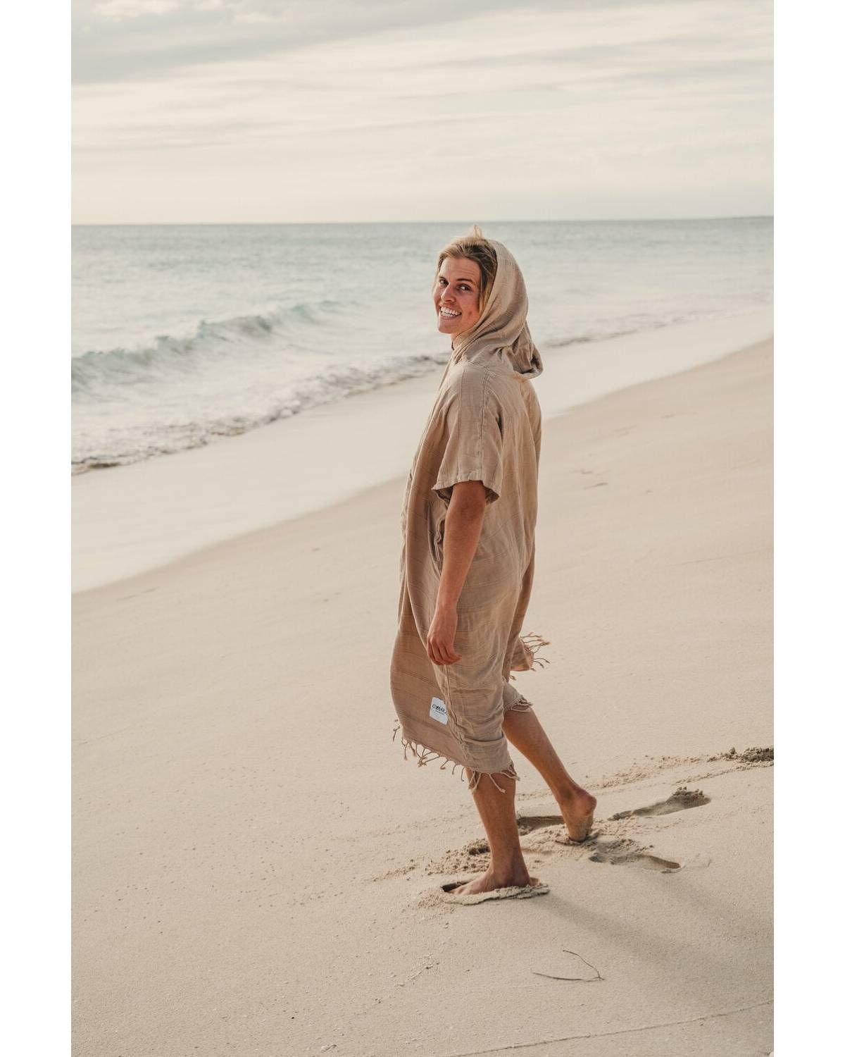 OZoola Surf Poncho - Sand on model at the beach