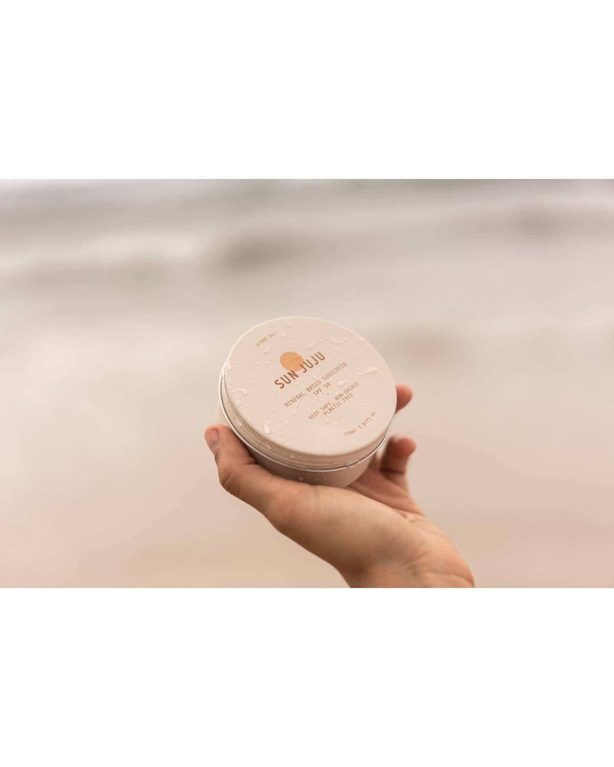 Sun Juju Reef Safe Mineral Based SPF50 Sunscreen tin in hand