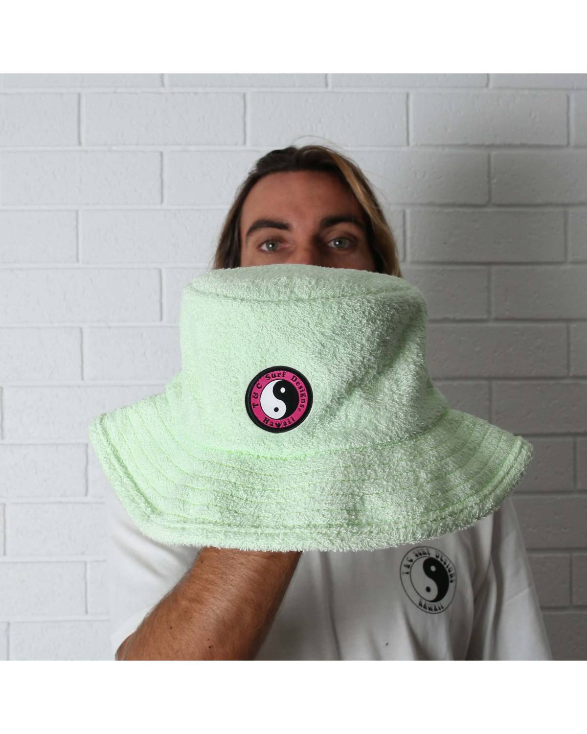 T&C Terry Beach Hat - Lime green held by man