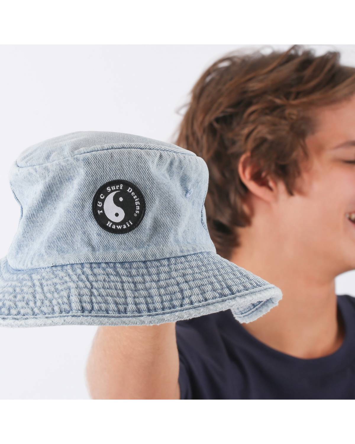 Hat held by model