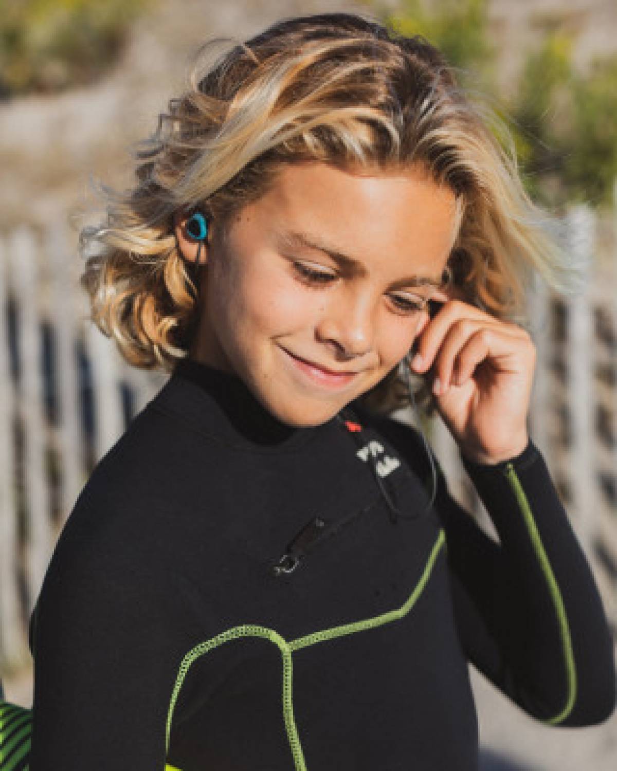 Surfears 2.0 worn by a kid grom surfer