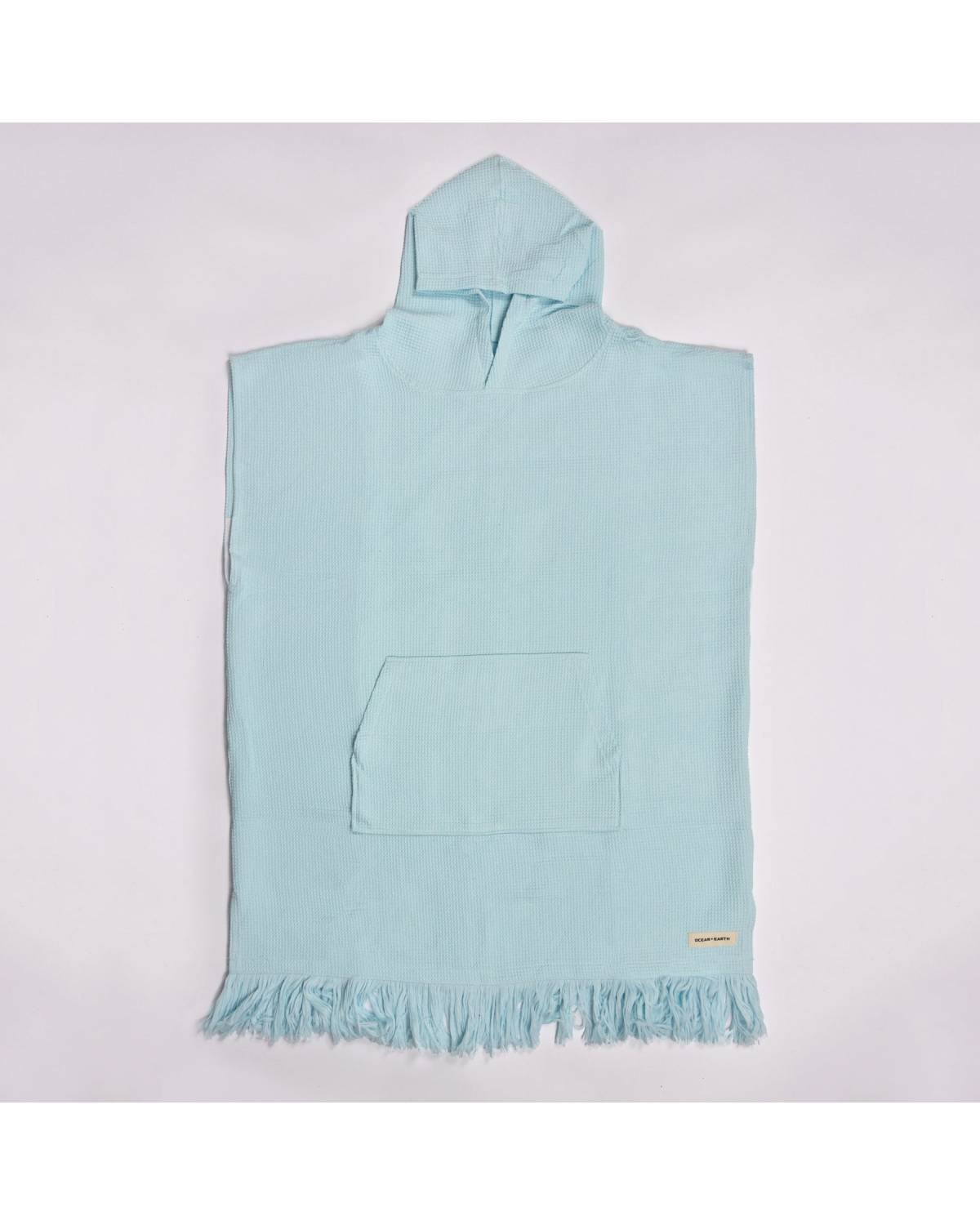 Flat lay of Bleached Aqua Poncho