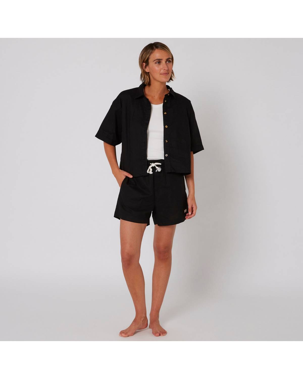 Model in full outfit with shorts