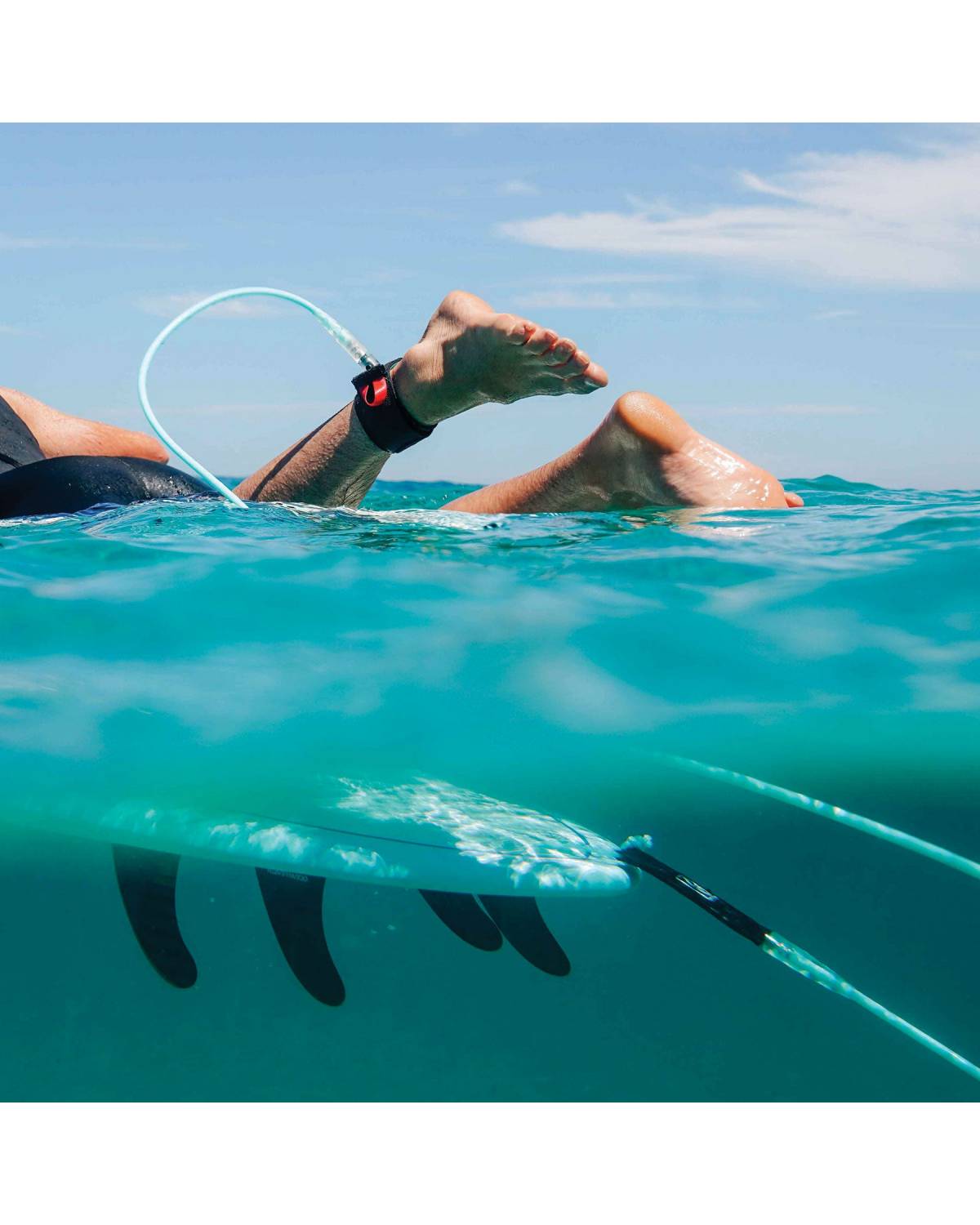 Surfboard leash in use
